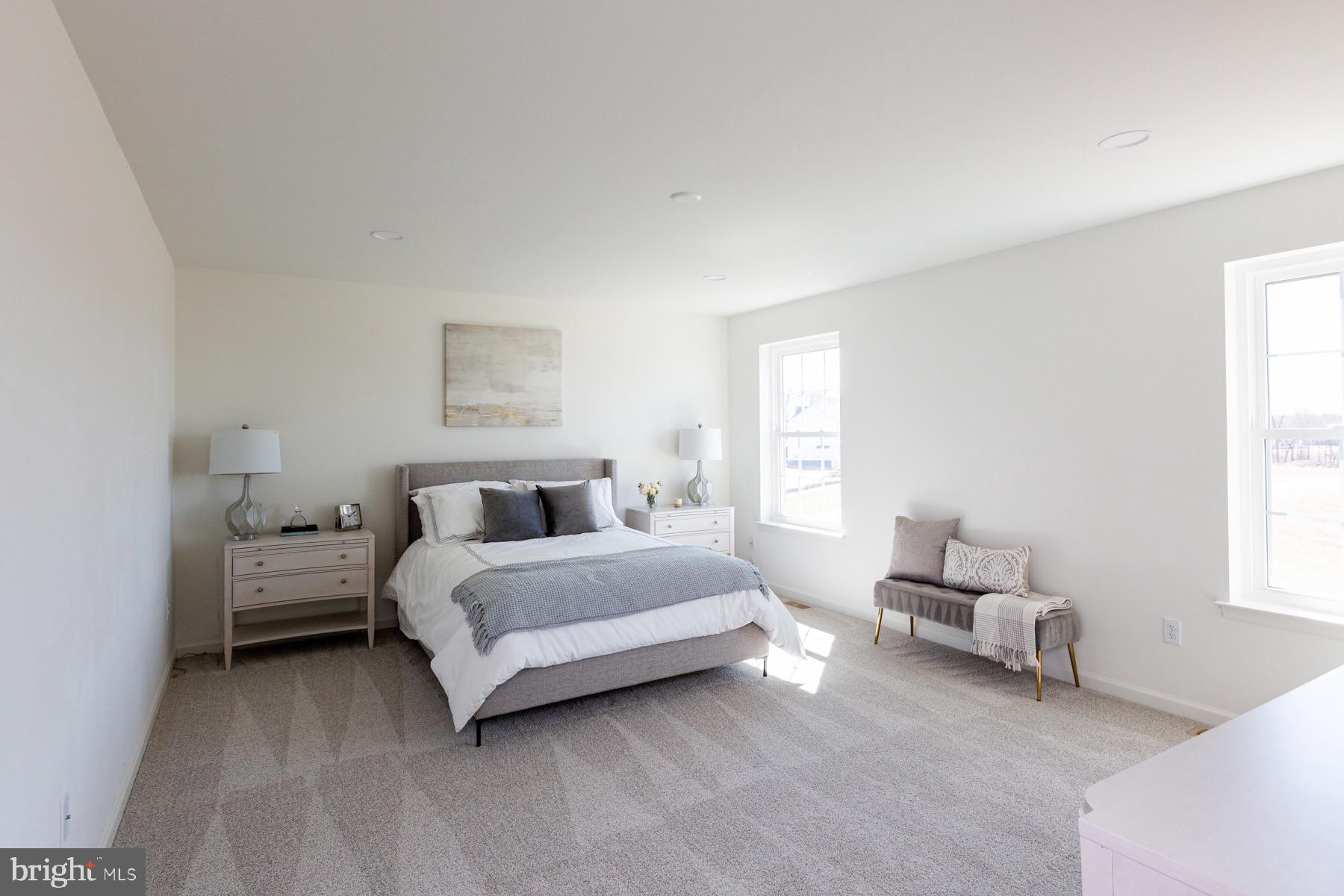 306 Wickmere Street, Unit 68 Oxford, PA 19363 - Photo 22 of 40 a spacious bedroom with a bed and a window