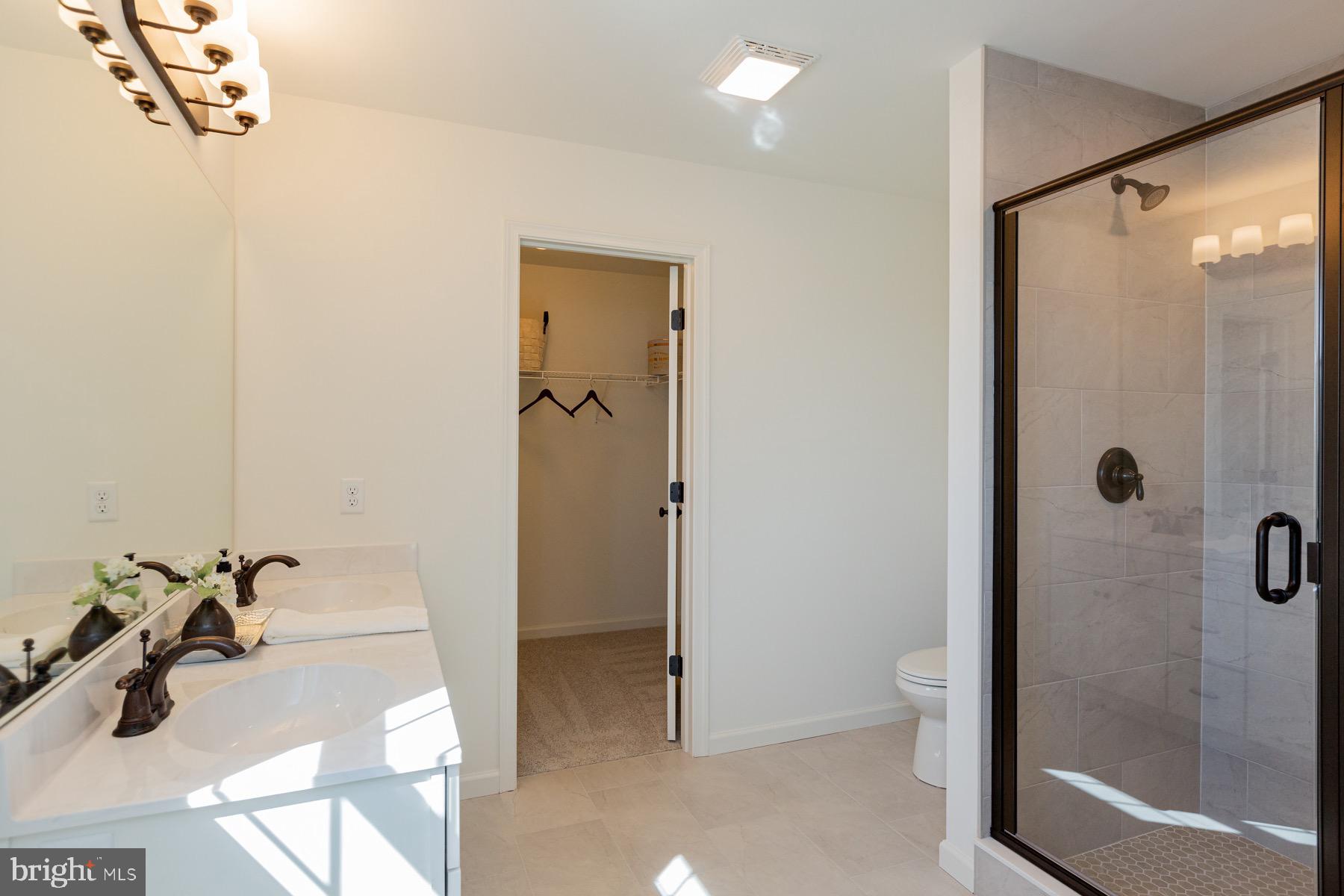 306 Wickmere Street, Unit 68 Oxford, PA 19363 - Photo 25 of 40 a bathroom with a sink and shower