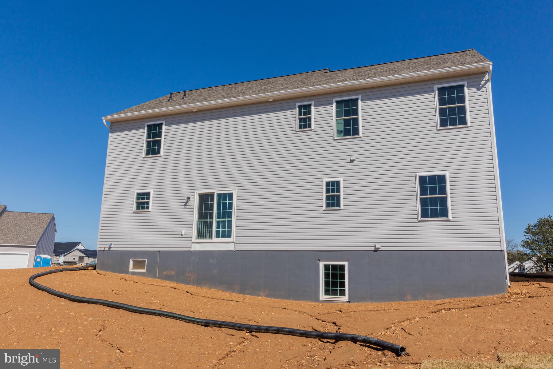 306 Wickmere Street, Unit 68 Oxford, PA 19363 - Photo 34 of 40 a front view of a house with a yard