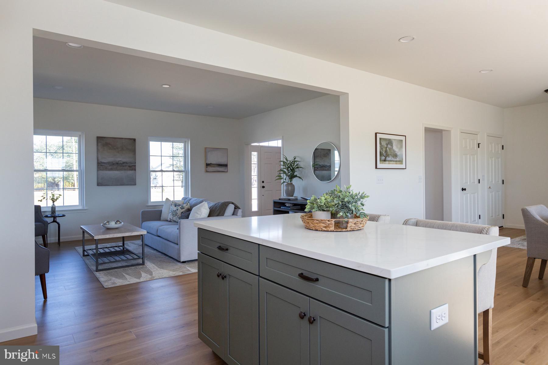 306 Wickmere Street, Unit 68 Oxford, PA 19363 - Photo 6 of 40 a view of living room with granite countertop furniture and wooden floor
