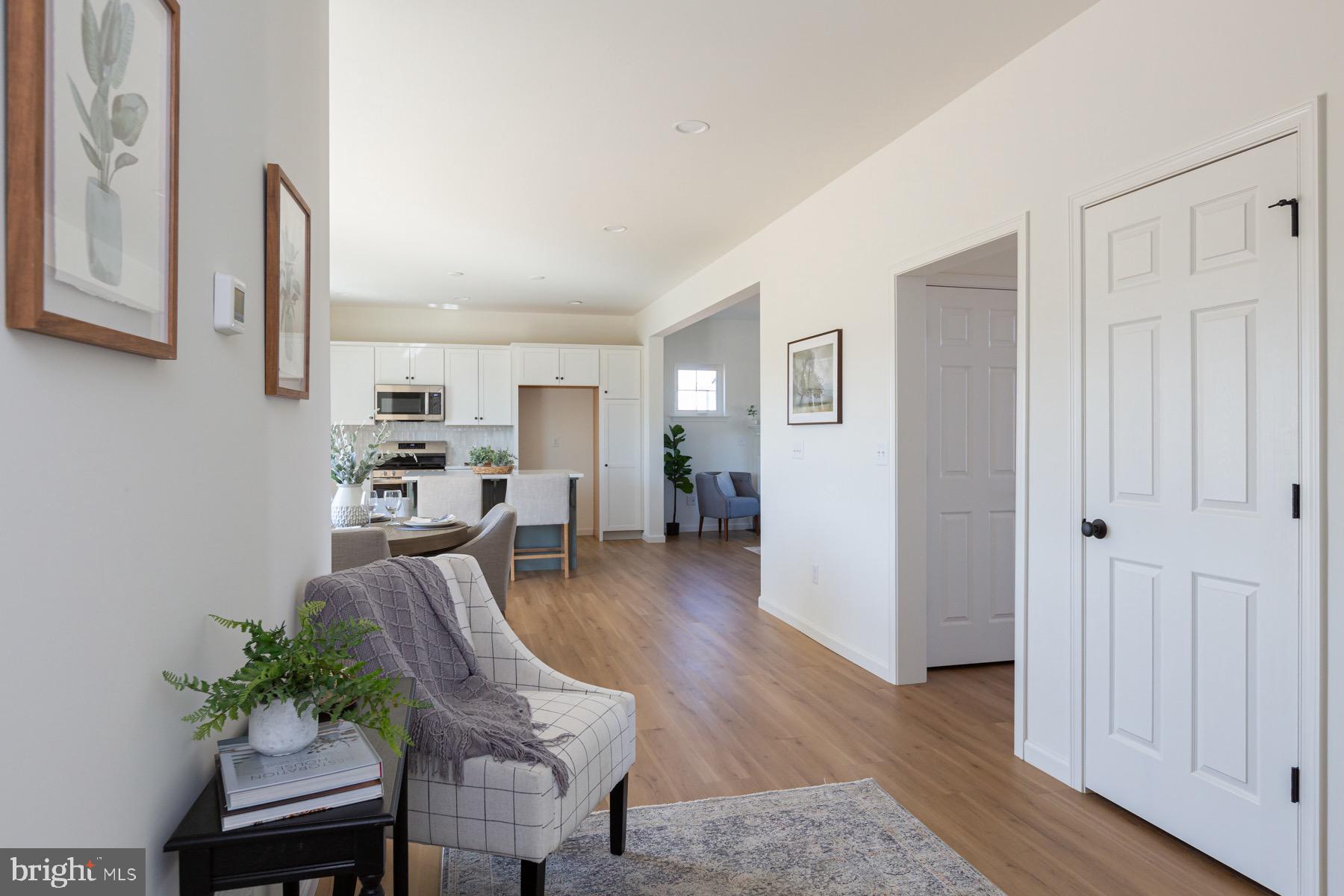306 Wickmere Street, Unit 68 Oxford, PA 19363 - Photo 8 of 40 a living room with furniture and a wooden floor