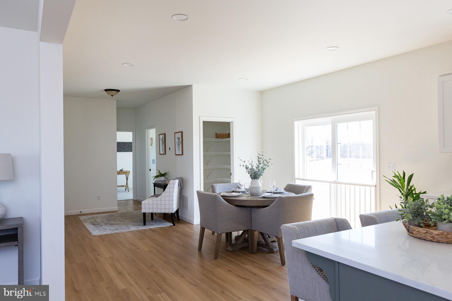 306 Wickmere Street, Unit 68 Oxford, PA 19363 - Photo 9 of 40 a living room with furniture and wooden floor