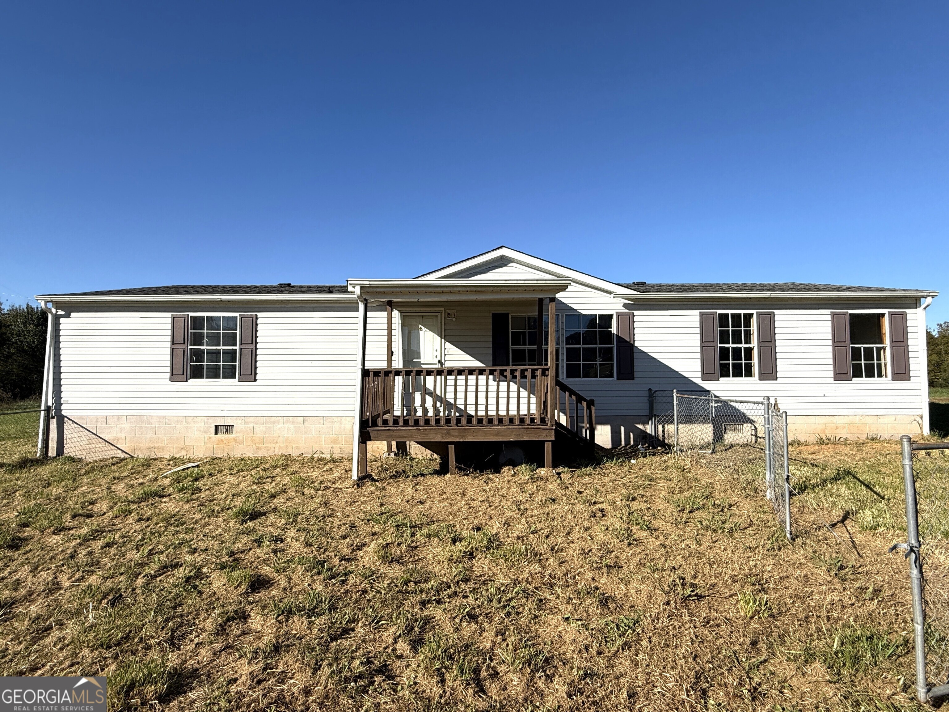 870 Grindle Brothers Road Murrayville, GA 30564 - Photo 1 of 1 a house with trees in the background