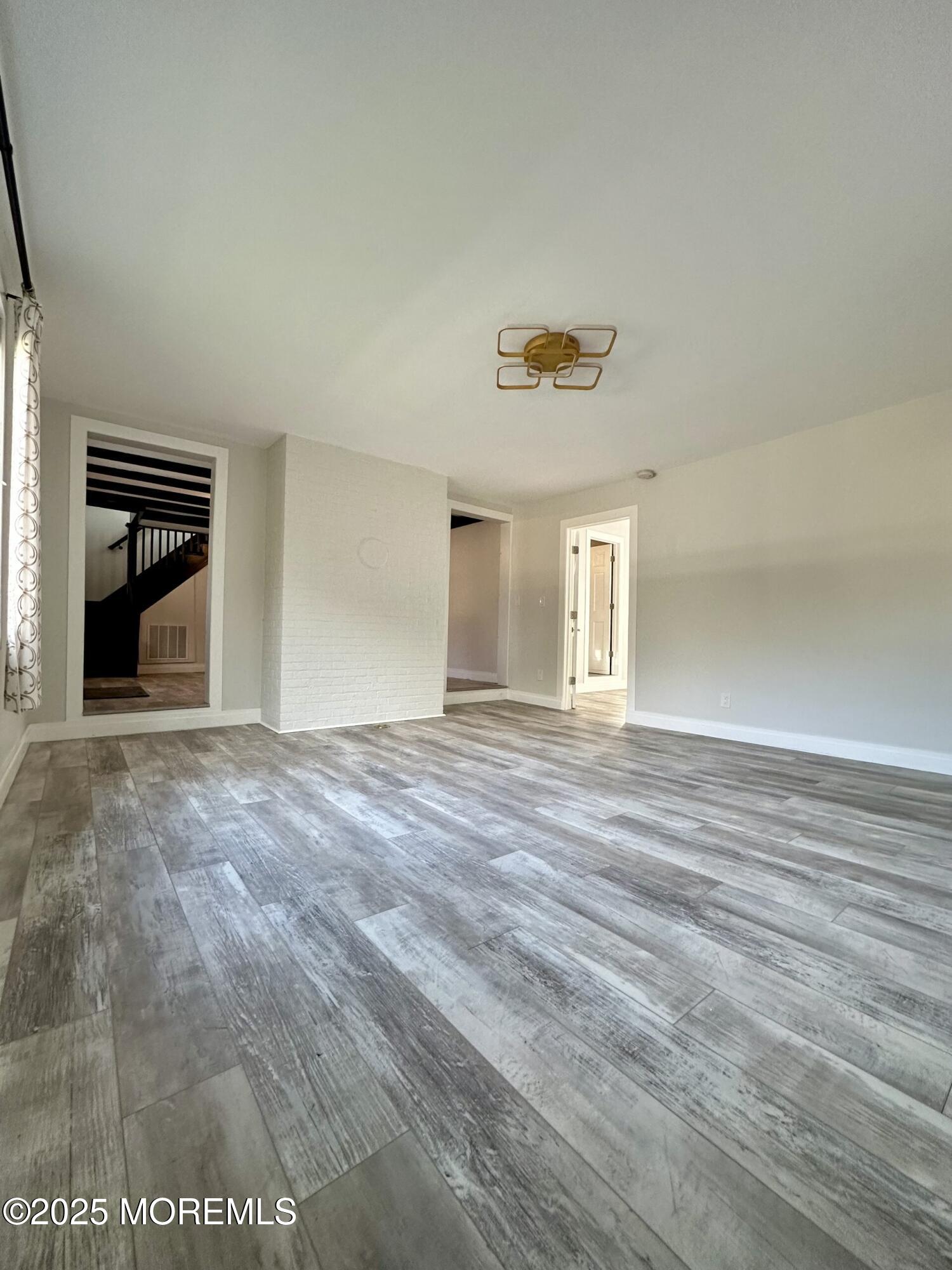 72 Main Street Holmdel, NJ 07733 - Photo 12 of 45 a view of an empty room with a window