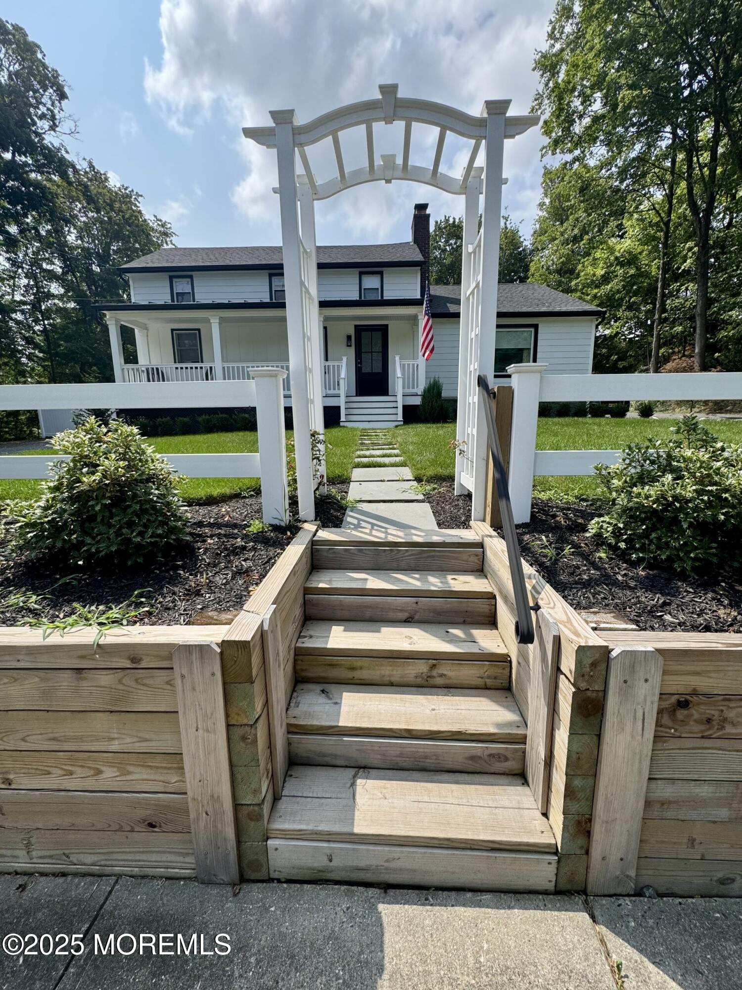 72 Main Street Holmdel, NJ 07733 - Photo 16 of 45 a front view of a house with a yard