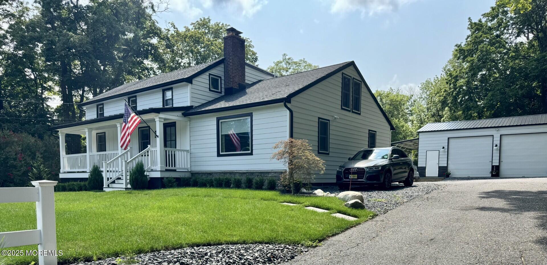 72 Main Street Holmdel, NJ 07733 - Photo 17 of 45 a front view of house with yard