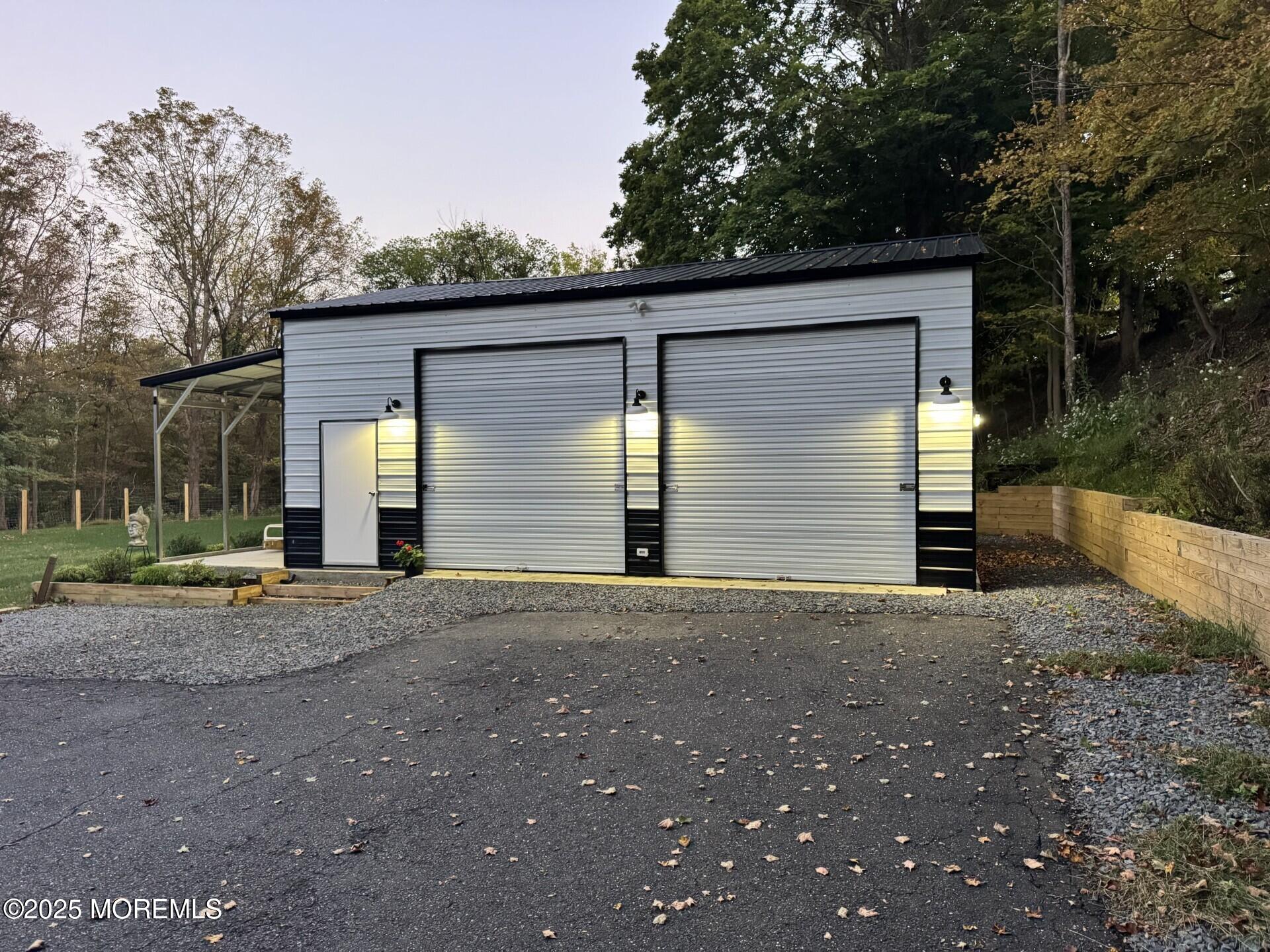 72 Main Street Holmdel, NJ 07733 - Photo 18 of 45 a view of backyard of house and garage