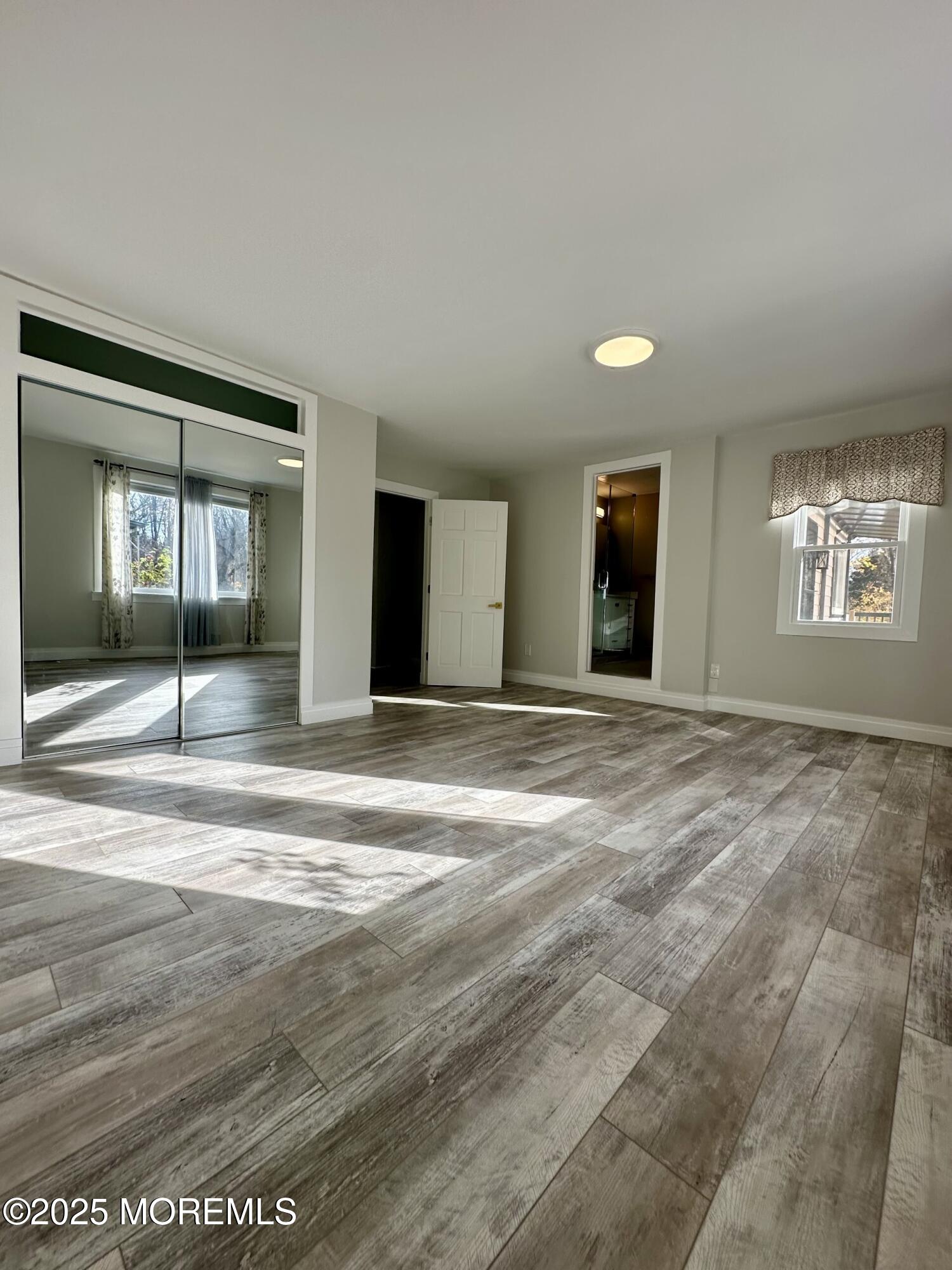 72 Main Street Holmdel, NJ 07733 - Photo 21 of 45 a view of a livingroom with a staircase