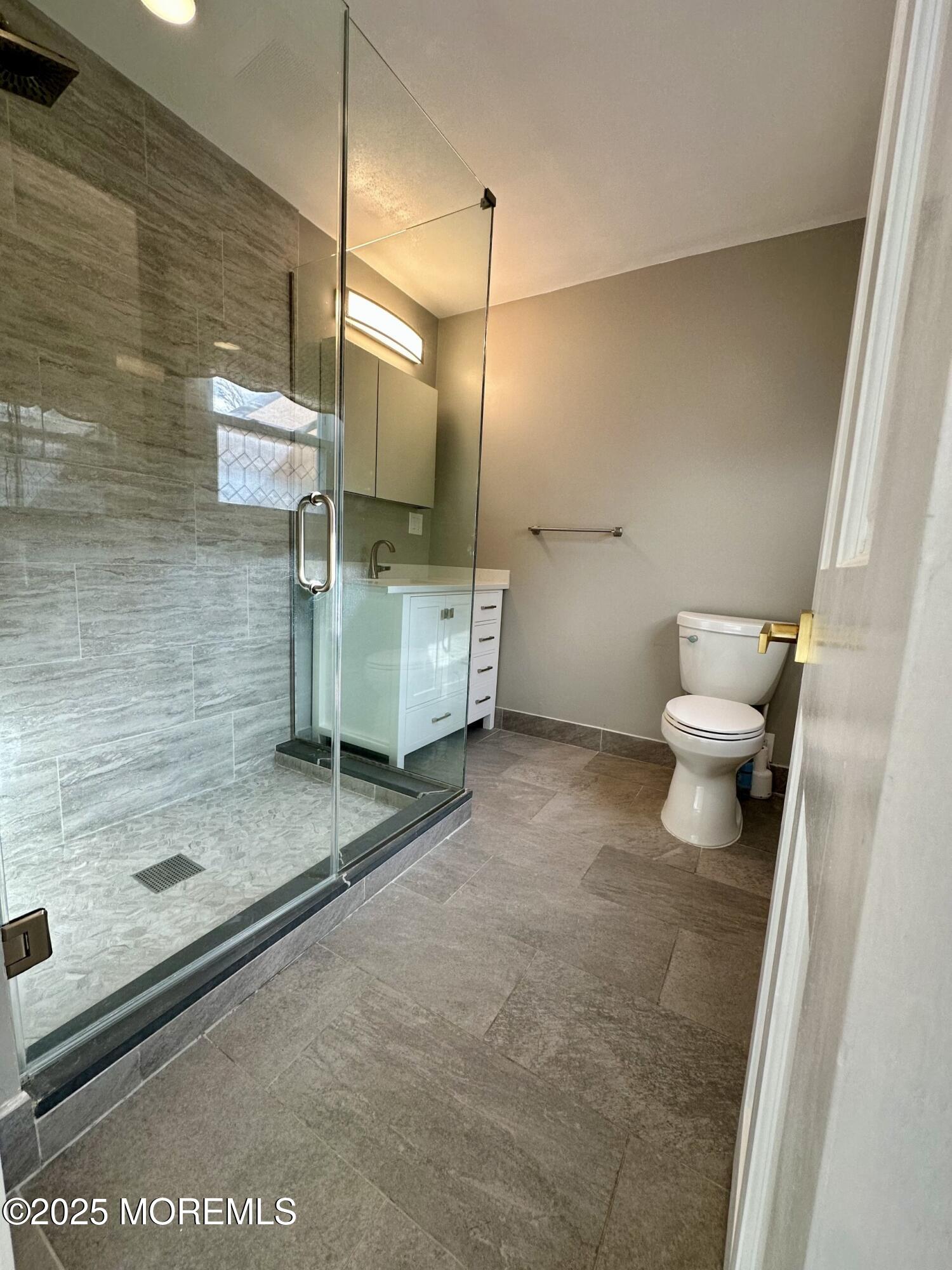 72 Main Street Holmdel, NJ 07733 - Photo 22 of 45 a bathroom with a granite countertop sink mirror and toilet