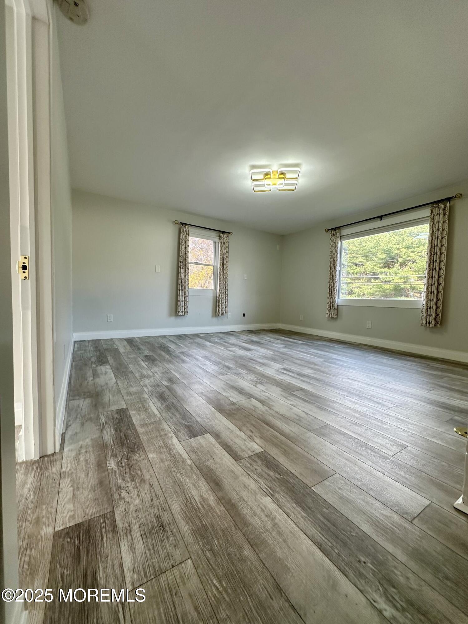72 Main Street Holmdel, NJ 07733 - Photo 24 of 45 a view of an empty room and window