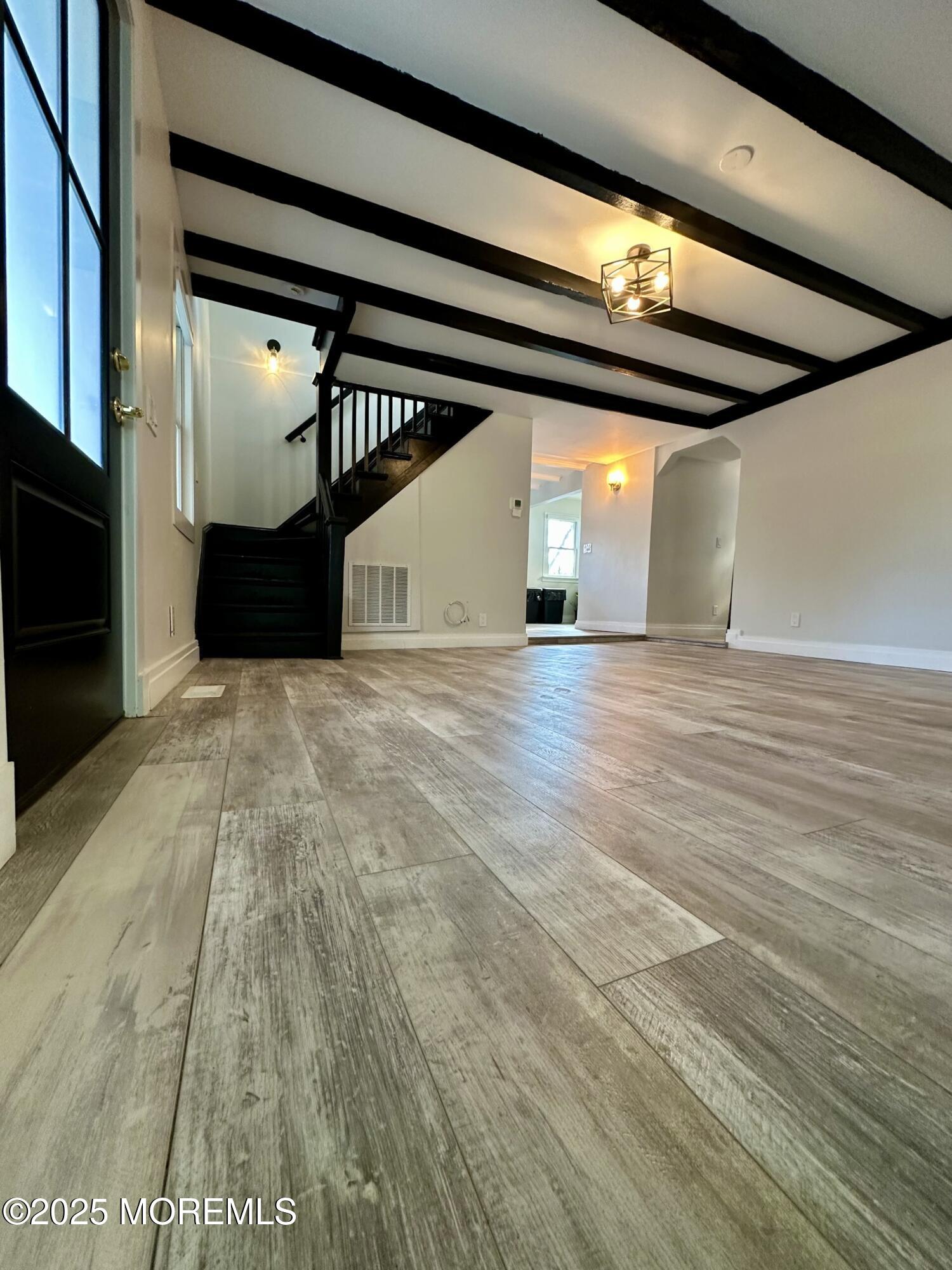 72 Main Street Holmdel, NJ 07733 - Photo 27 of 45 a view of empty room with wooden floor