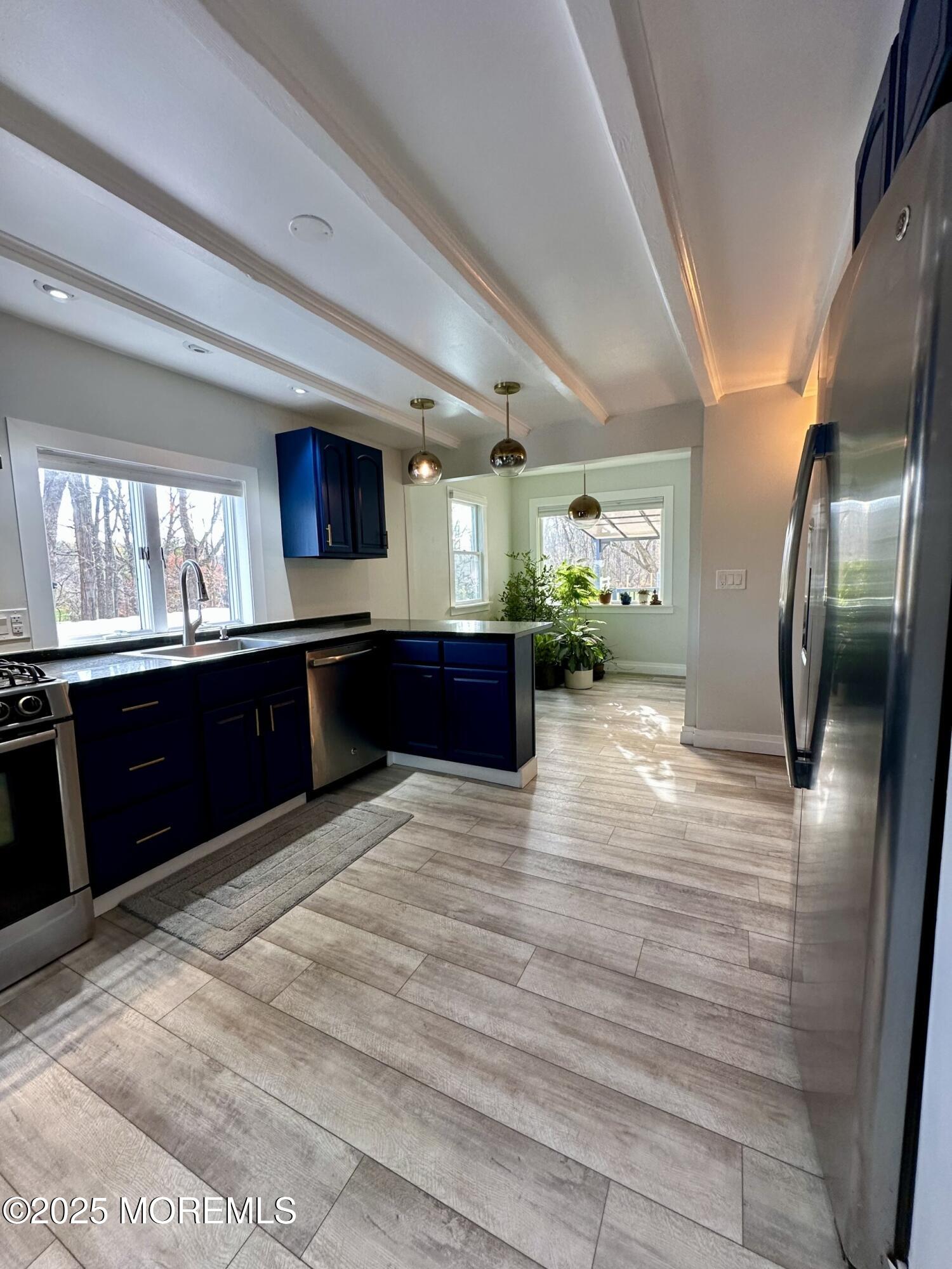 72 Main Street Holmdel, NJ 07733 - Photo 3 of 45 a kitchen with stainless steel appliances granite countertop a refrigerator a stove and a sink