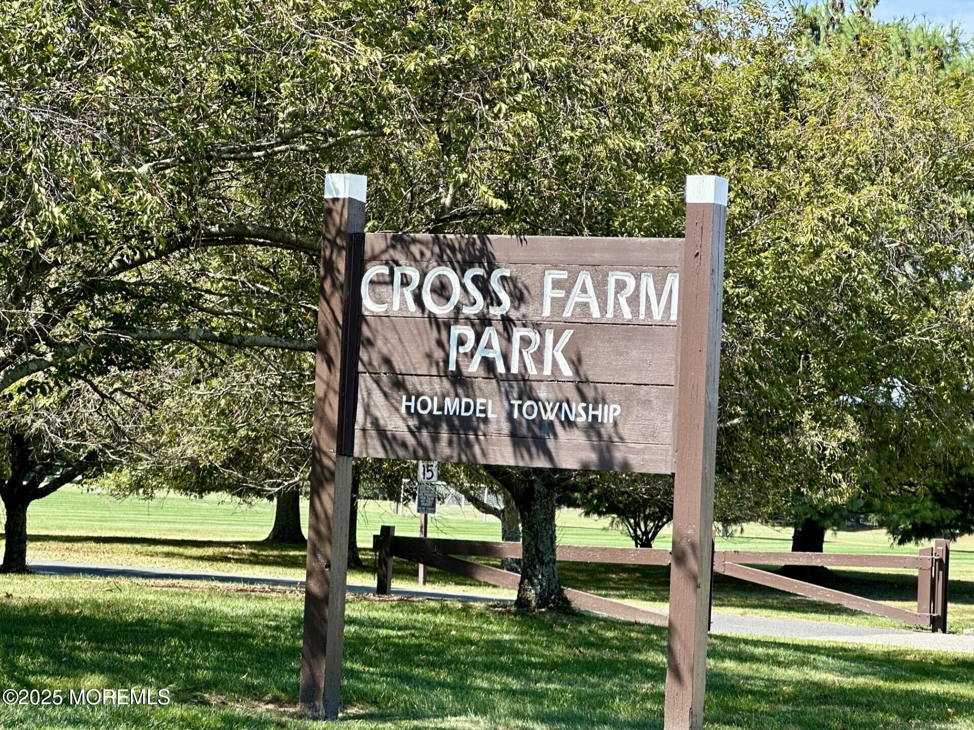 72 Main Street Holmdel, NJ 07733 - Photo 36 of 45 a view of a street sign under a large tree