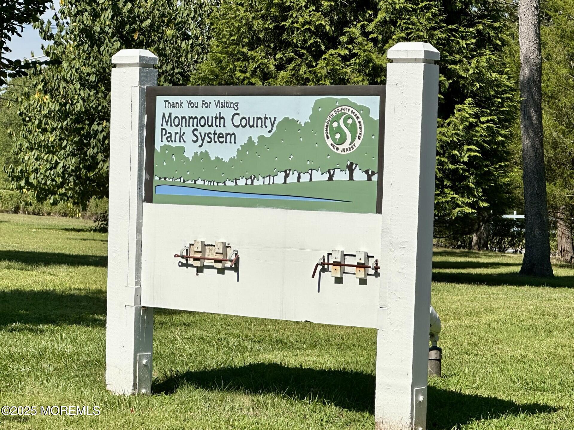 72 Main Street Holmdel, NJ 07733 - Photo 37 of 45 a view of outdoor space with a garden and signage