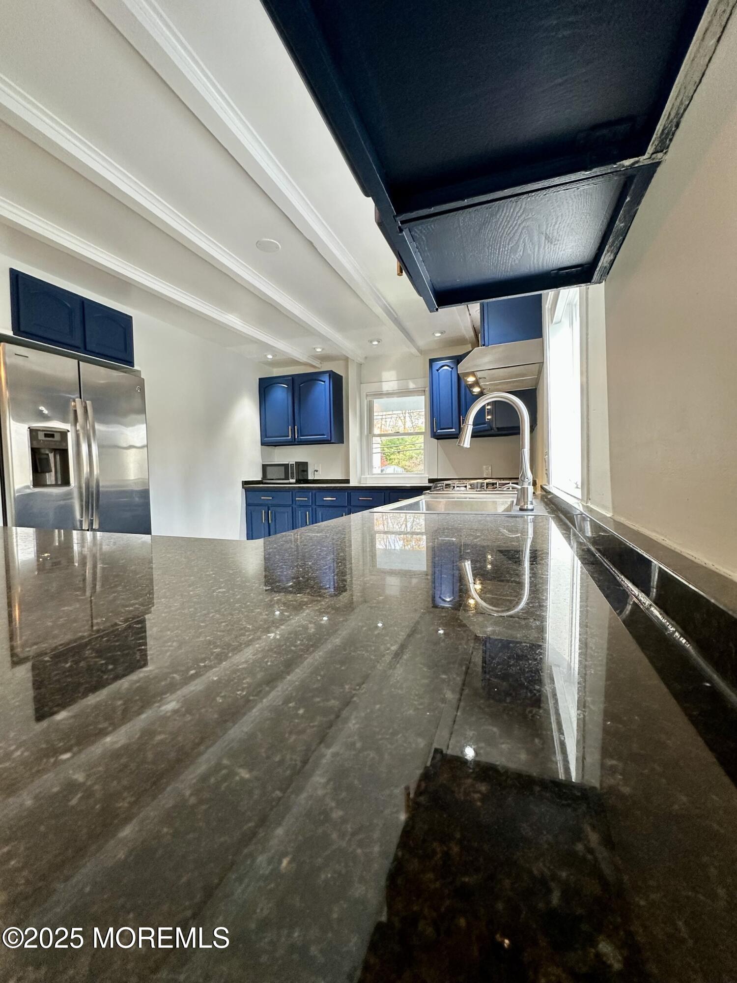 72 Main Street Holmdel, NJ 07733 - Photo 4 of 45 a kitchen with granite countertop a sink and a stove