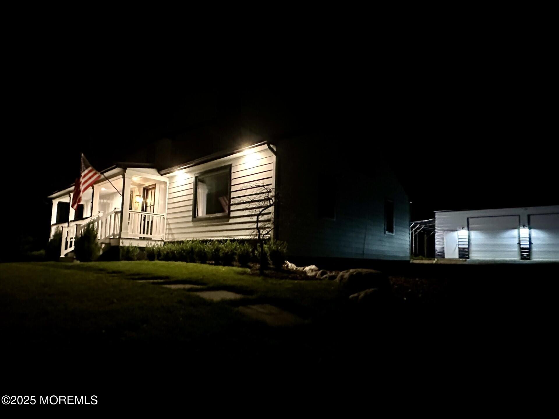 72 Main Street Holmdel, NJ 07733 - Photo 42 of 45 a front view of a house with a garden