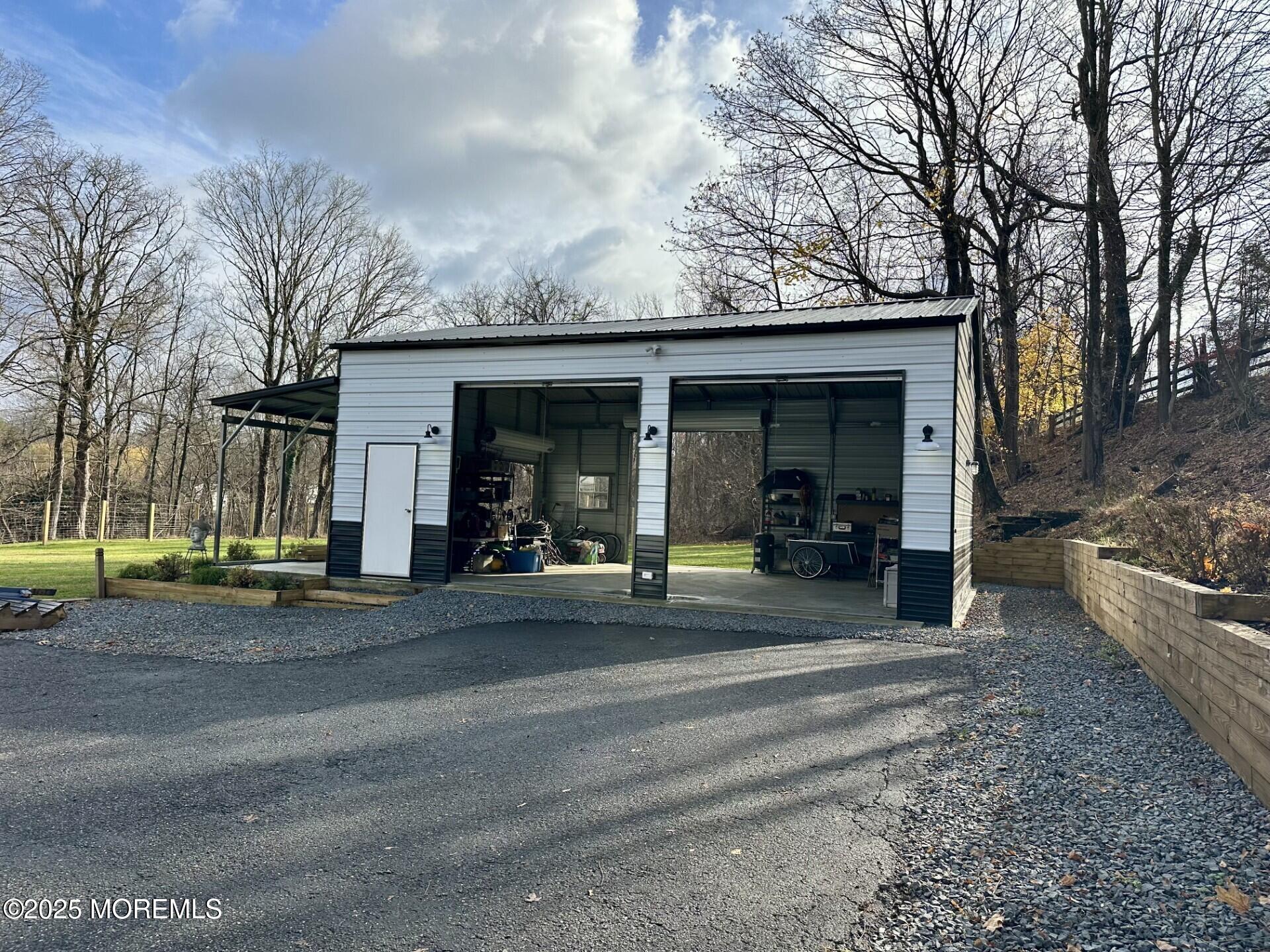 72 Main Street Holmdel, NJ 07733 - Photo 43 of 45 a view of a car park in front of house