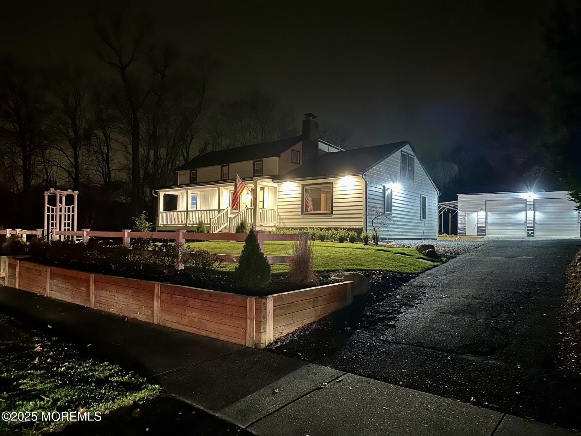 72 Main Street Holmdel, NJ 07733 - Photo 45 of 45 a front view of a house with a yard