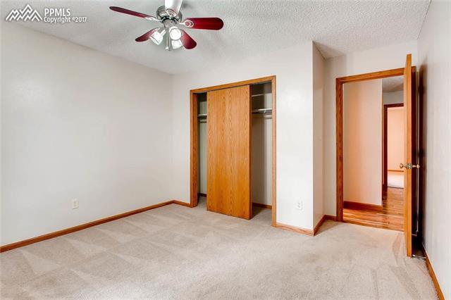 4672 Ranch Drive Colorado Springs, CO 80918 - Photo 14 of 27 The third bedroom and its closet.