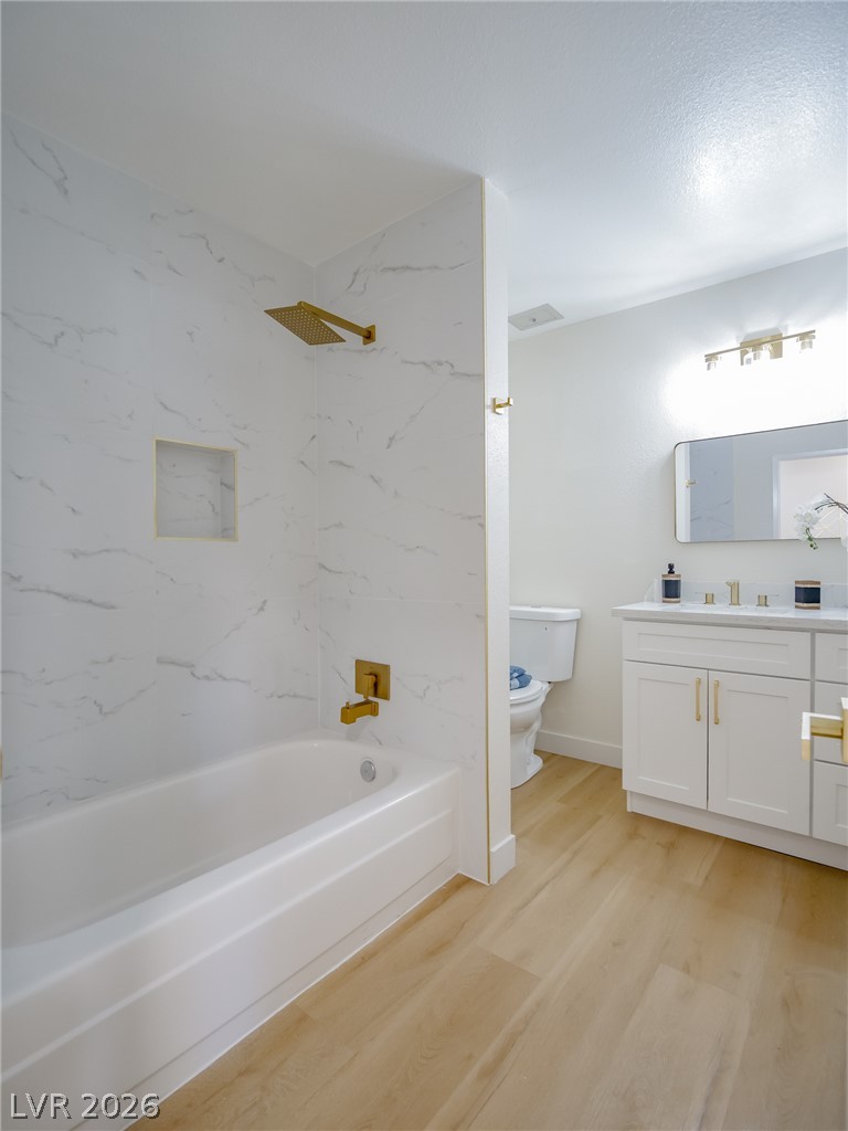 321 Lakehurst Road Las Vegas, NV 89145 - Photo 19 of 33 A white vanity with quartz countertops pairs with warm gold fixtures.