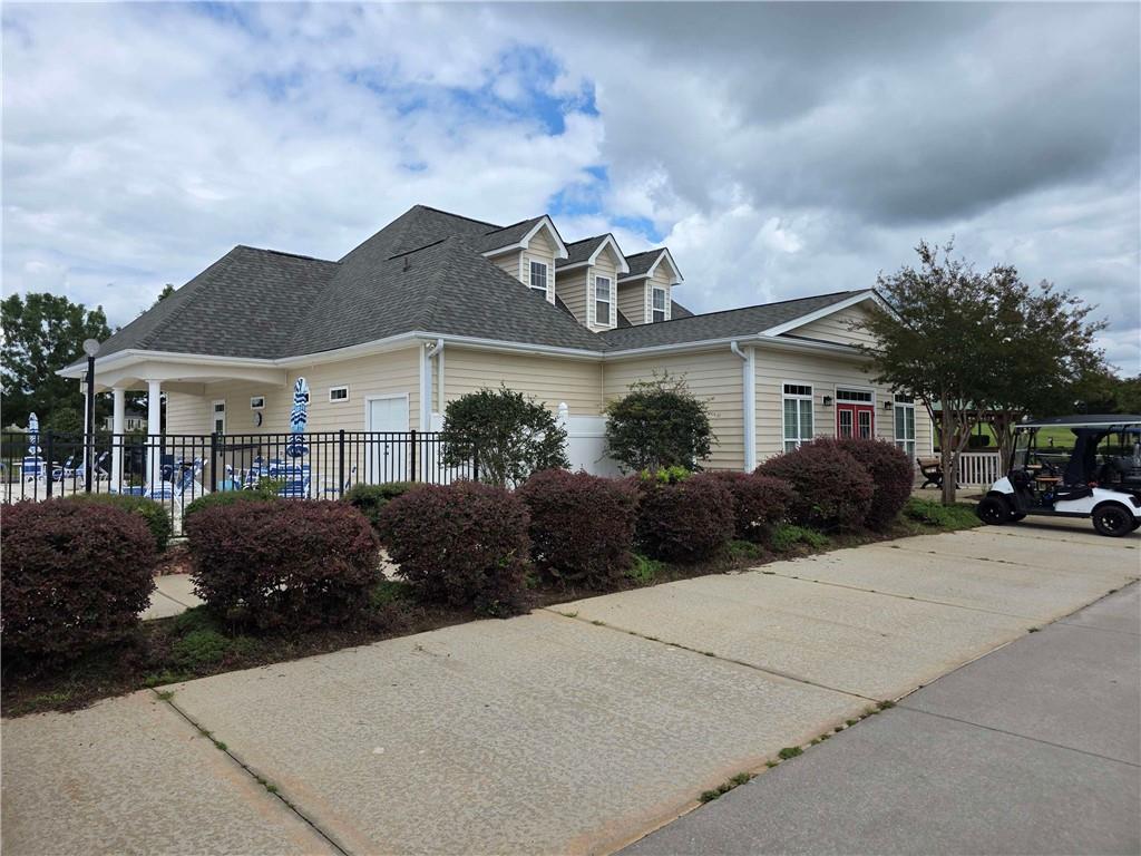 902 Quail Ridge Lane Perry, GA 31069 - Photo 4 of 25 front view of a house with a garden