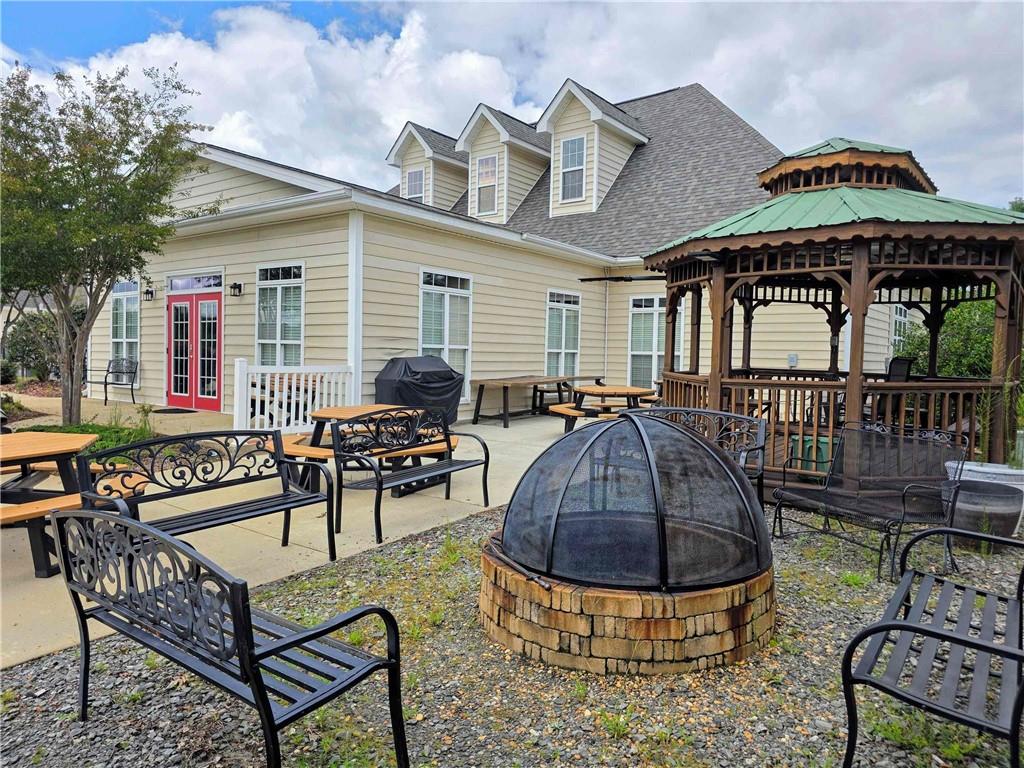 902 Quail Ridge Lane Perry, GA 31069 - Photo 6 of 25 a swimming pool view with a seating space
