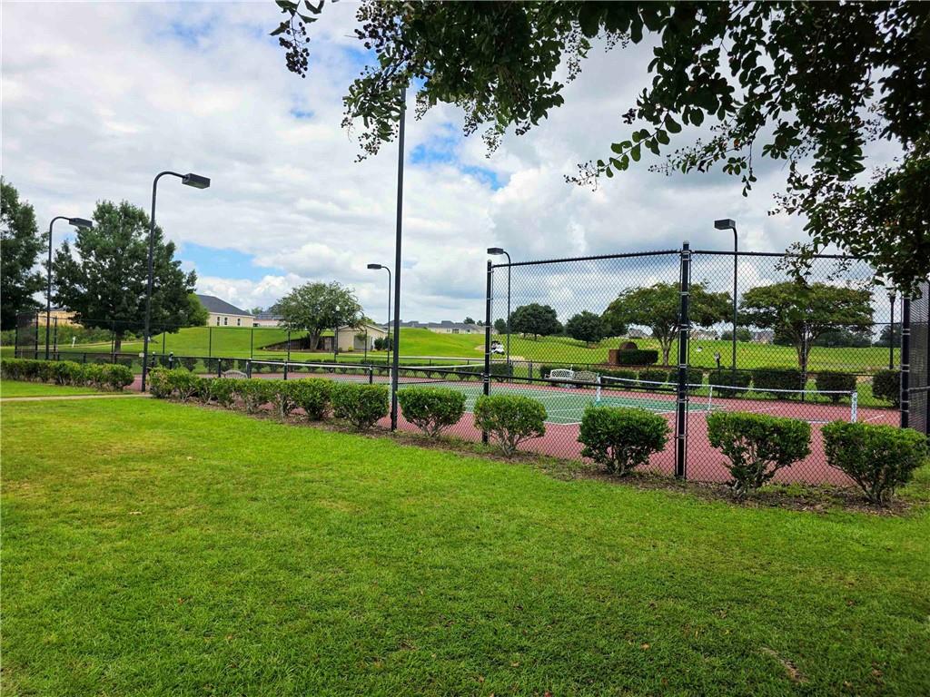 902 Quail Ridge Lane Perry, GA 31069 - Photo 7 of 25 a view of a garden and a fountain