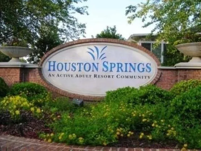 a view of outdoor space with signage and flags