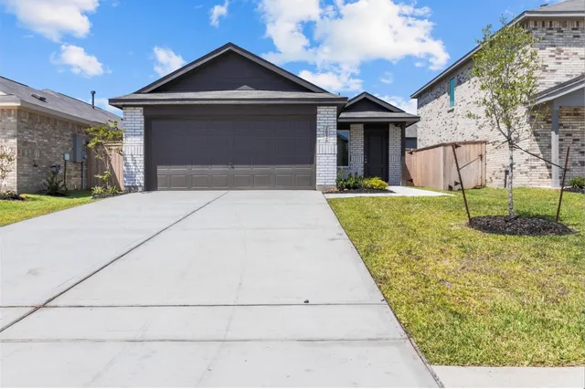 a front view of a house with yard