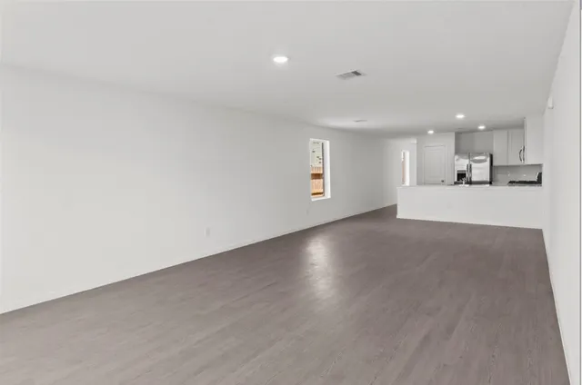 a view of a kitchen with a sink and a window
