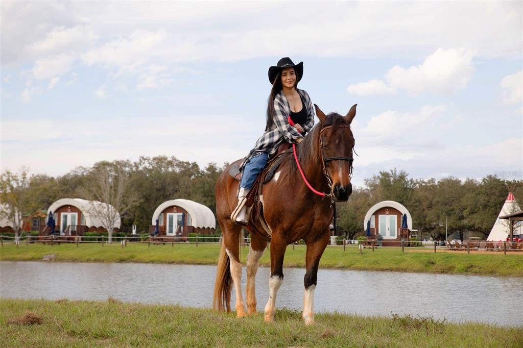 3200 River Ranch Boulevard, Unit 151 River Ranch, FL 33867 - Photo 25 of 28 a front view of a house with garden space and car parked