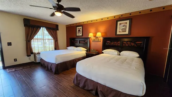 a bedroom with bed and window