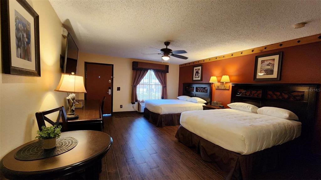 3200 River Ranch Boulevard, Unit 151 River Ranch, FL 33867 - Photo 6 of 28 a living room with fireplace furniture and a chandelier