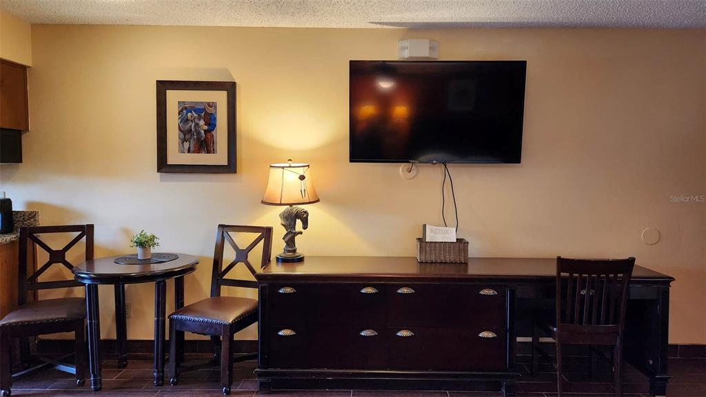 3200 River Ranch Boulevard, Unit 151 River Ranch, FL 33867 - Photo 8 of 28 a living room with furniture and a flat screen tv