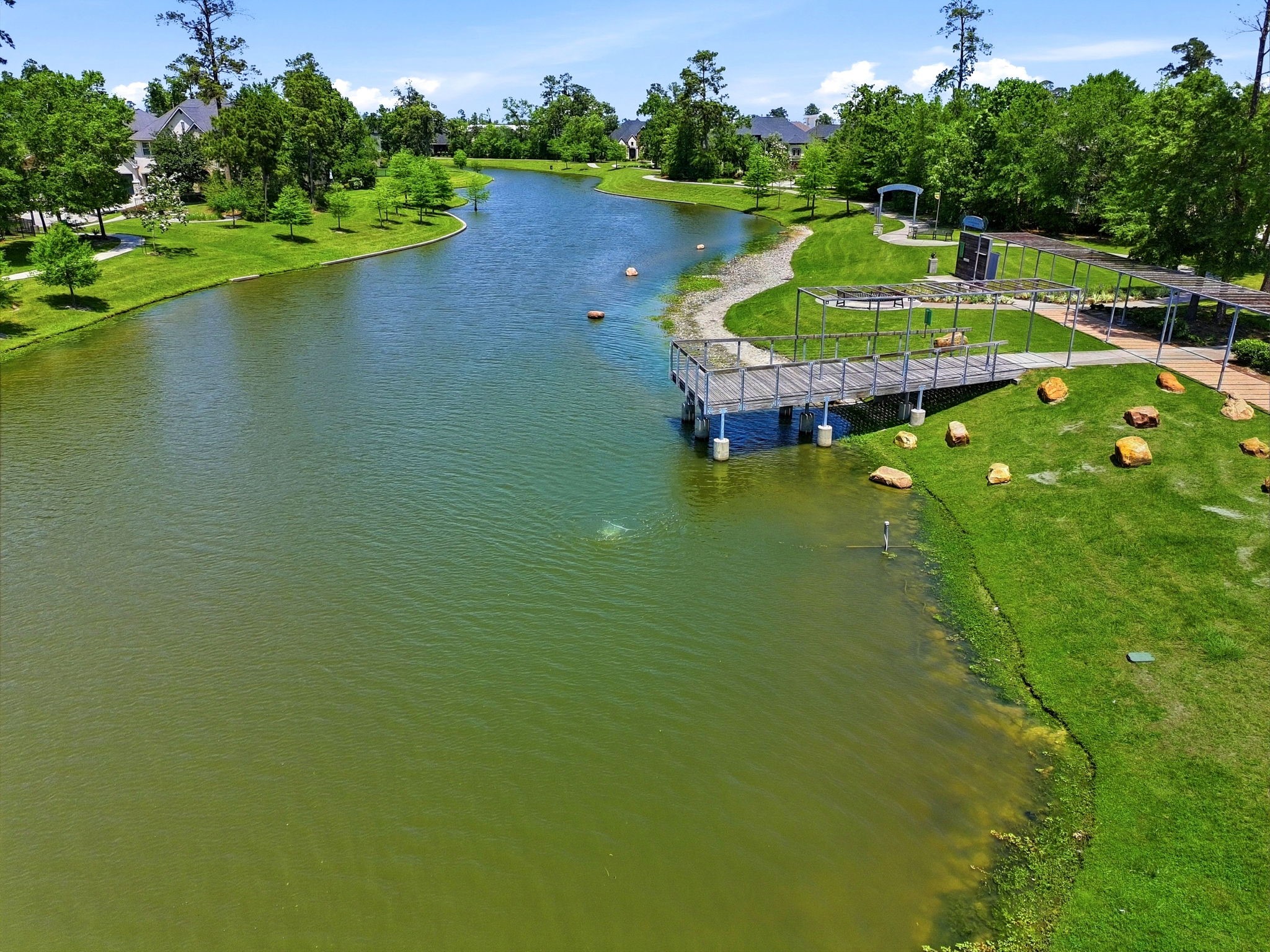 10062 South Goshawk Trail Conroe, TX 77385 - Photo 42 of 43 a swimming pool with outdoor seating and yard