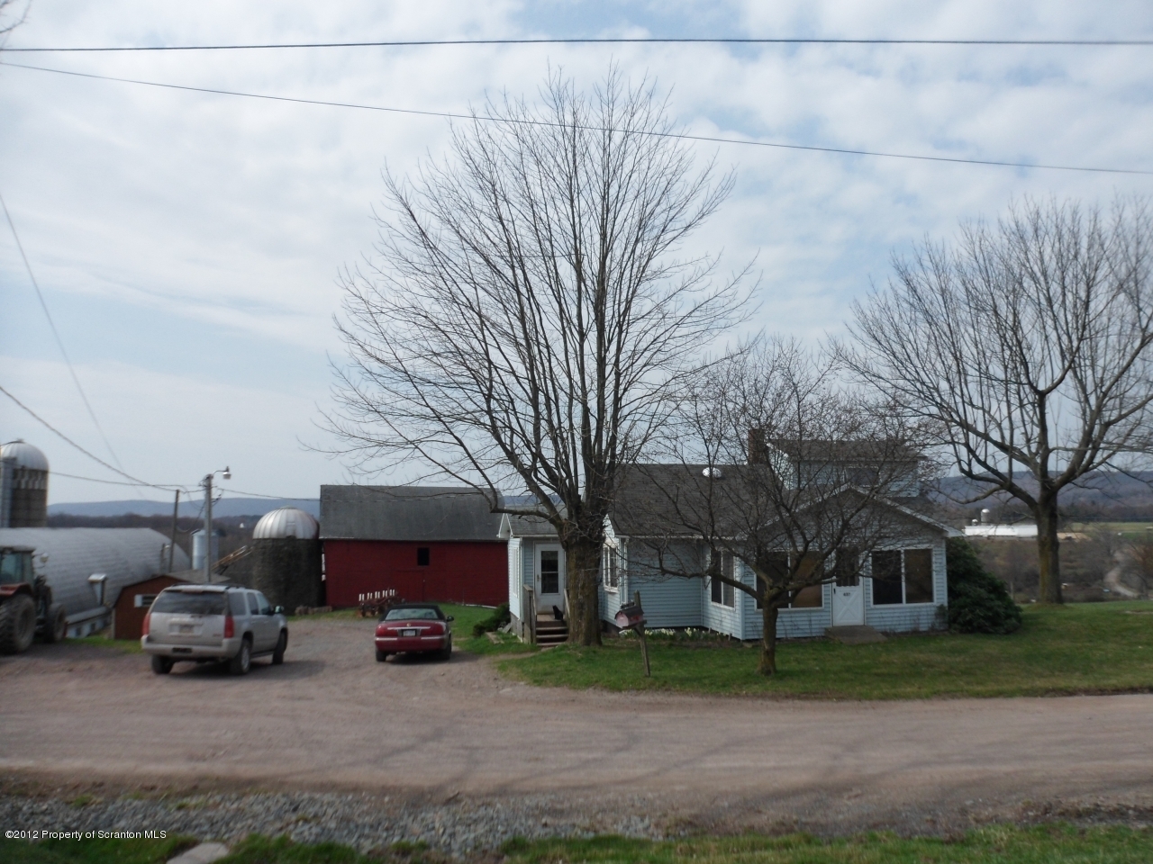 a view of a cars parked in front of a house
