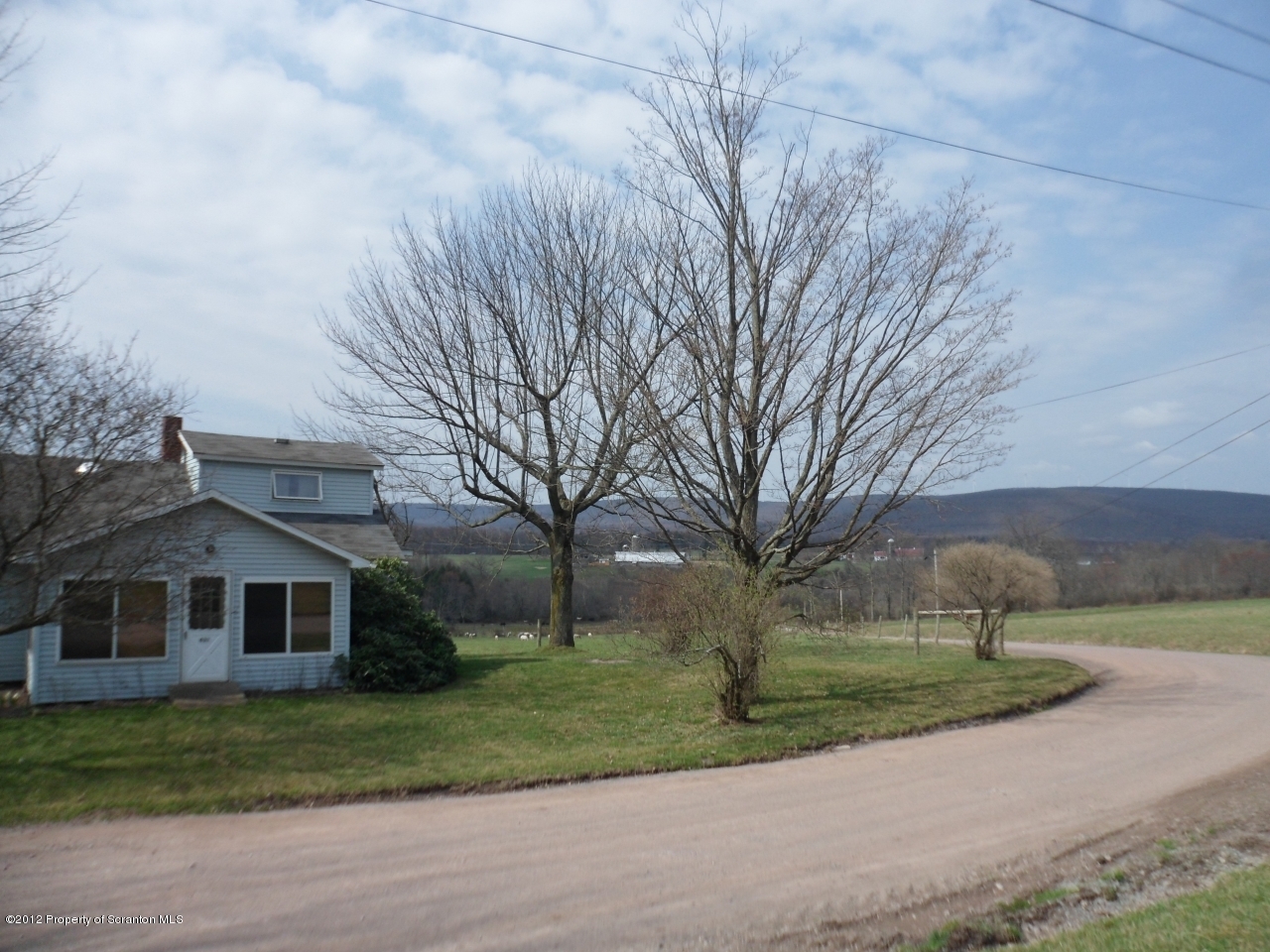 437 North Baker Road Waymart, PA 18472 - Photo 20 of 22 a front view of a house with a yard