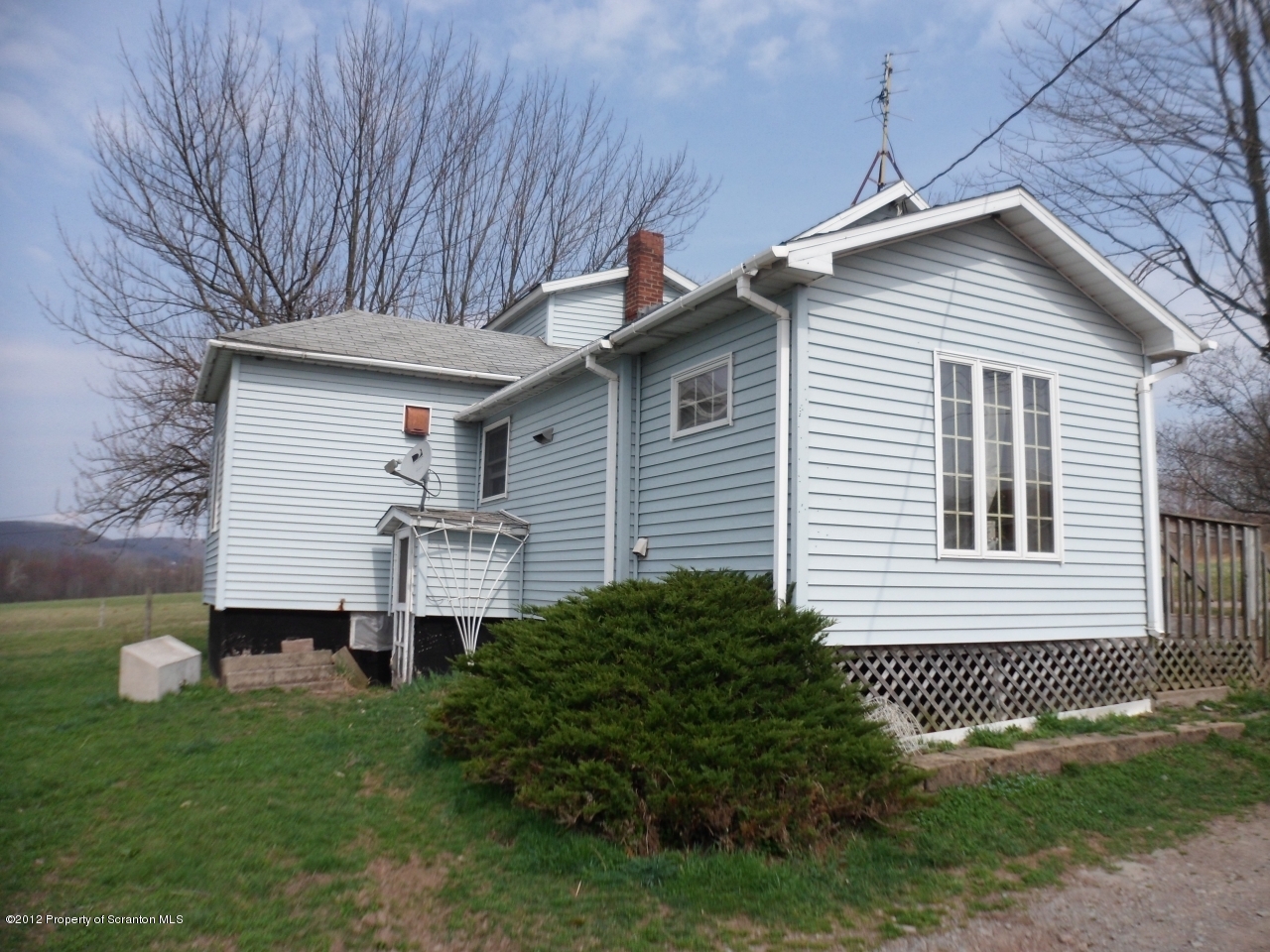437 North Baker Road Waymart, PA 18472 - Photo 2 of 22 a front view of a house with a yard