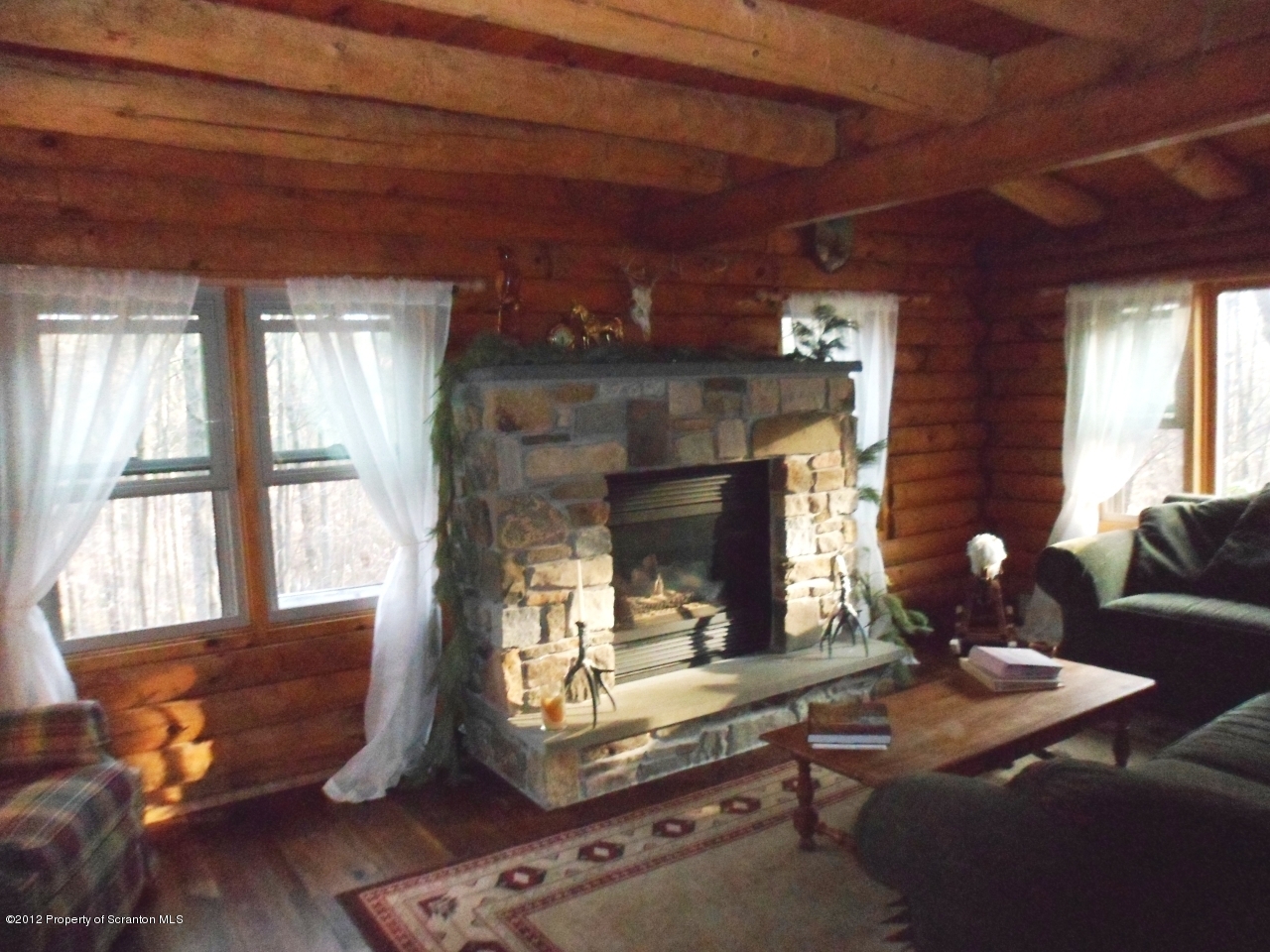 437 North Baker Road Waymart, PA 18472 - Photo 10 of 22 a living room with furniture and a fireplace