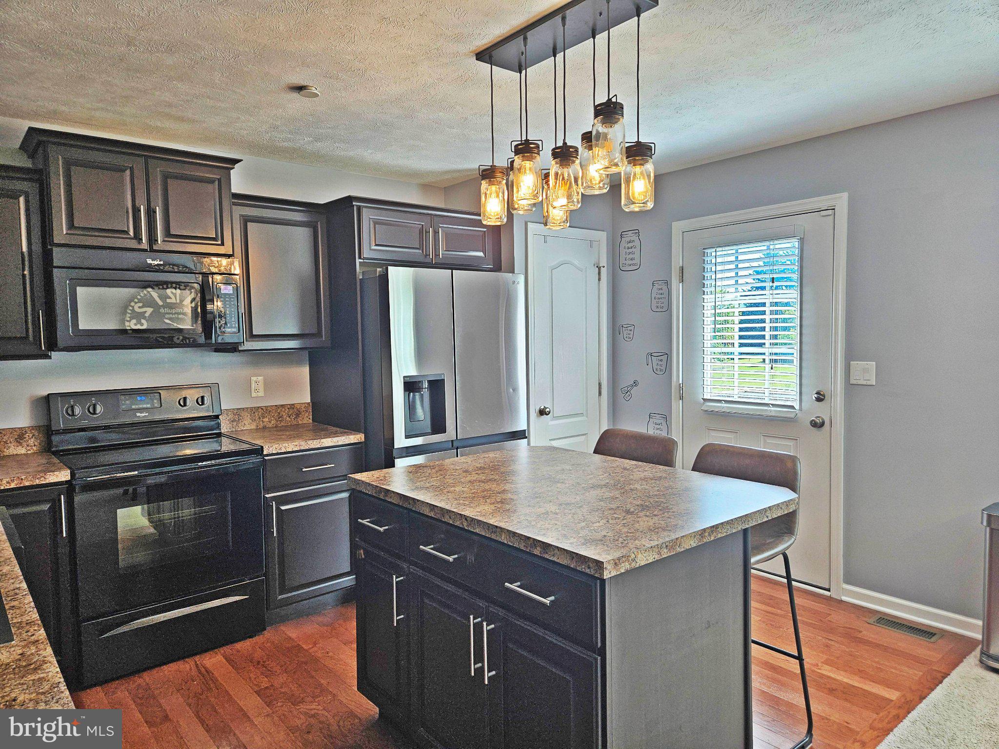 466 Stableview Court Duncansville, PA 16635 - Photo 9 of 22 Modern kitchen with stylish lighting.
