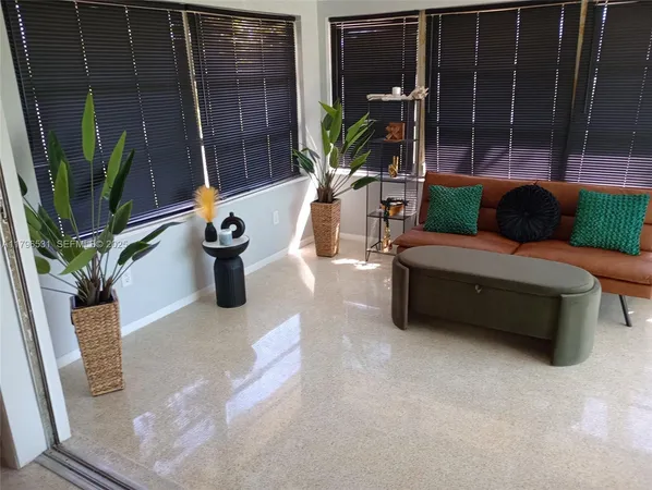 a outdoor living space with furniture and a potted plant