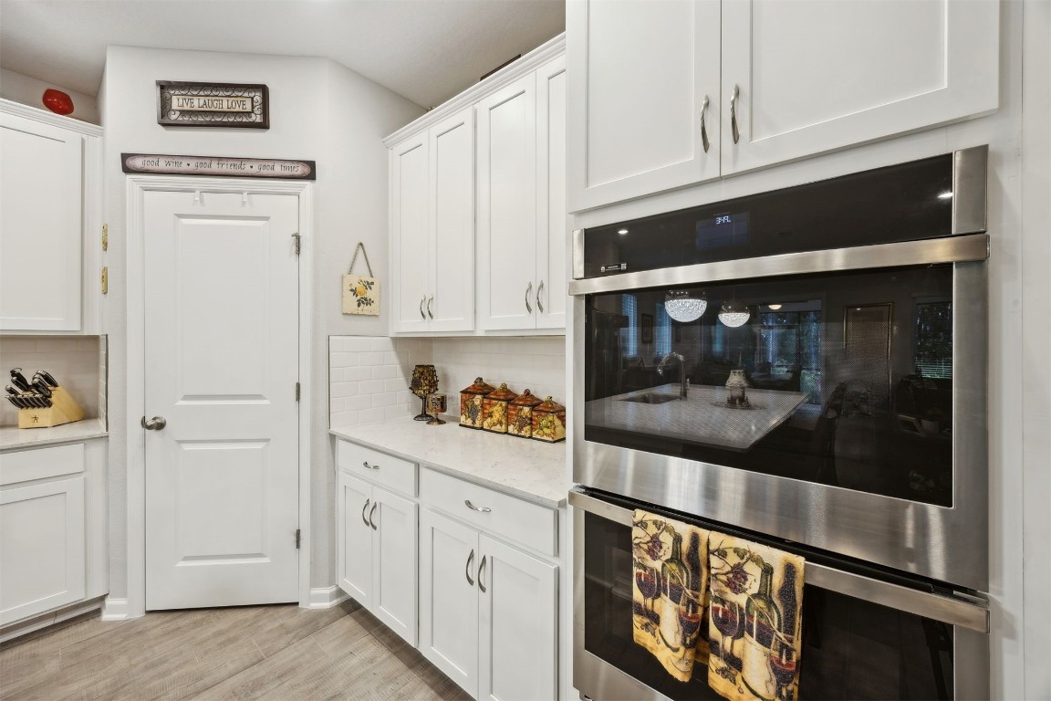 75505 Banyan Way Yulee, FL 32097 - Photo 15 of 94 a kitchen with stainless steel appliances white cabinets and a refrigerator