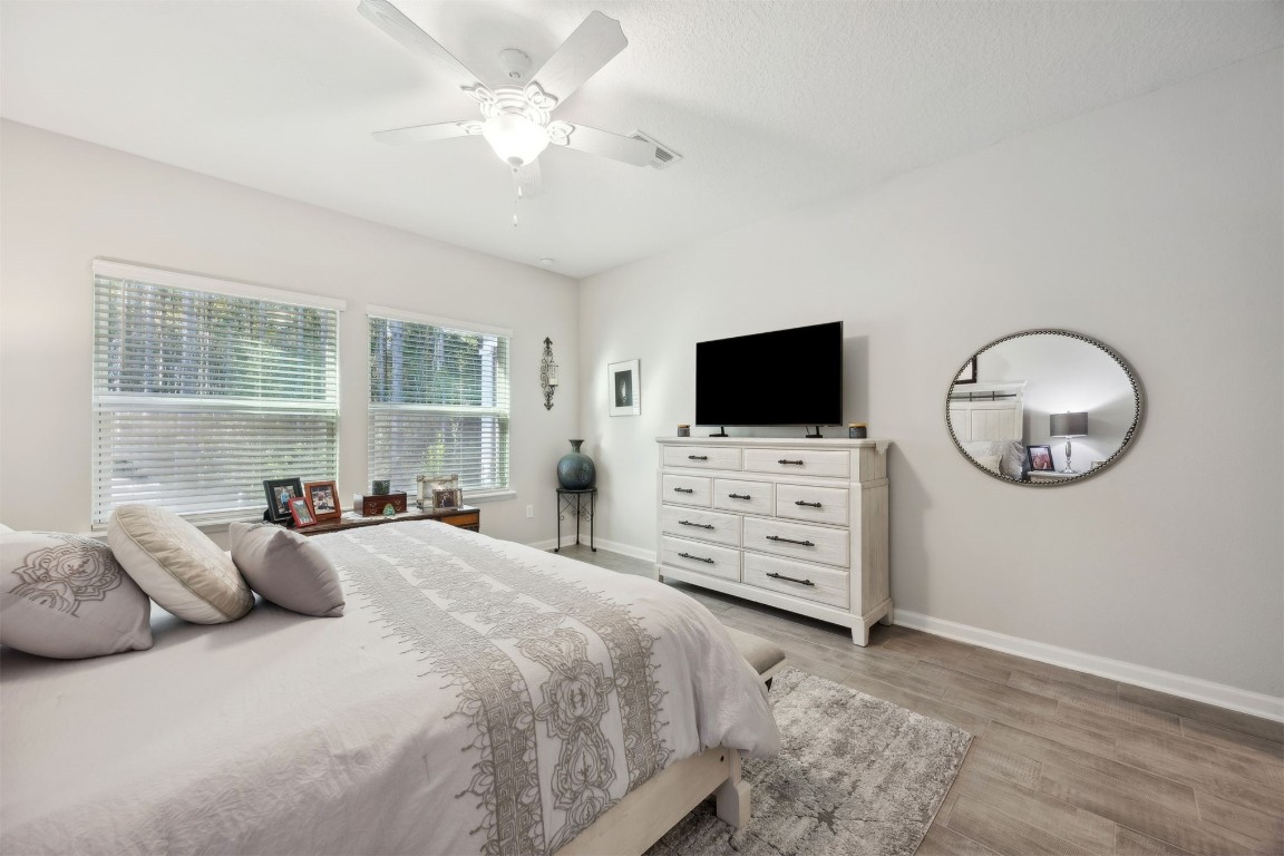 75505 Banyan Way Yulee, FL 32097 - Photo 25 of 94 a bedroom with furniture and flat screen tv
