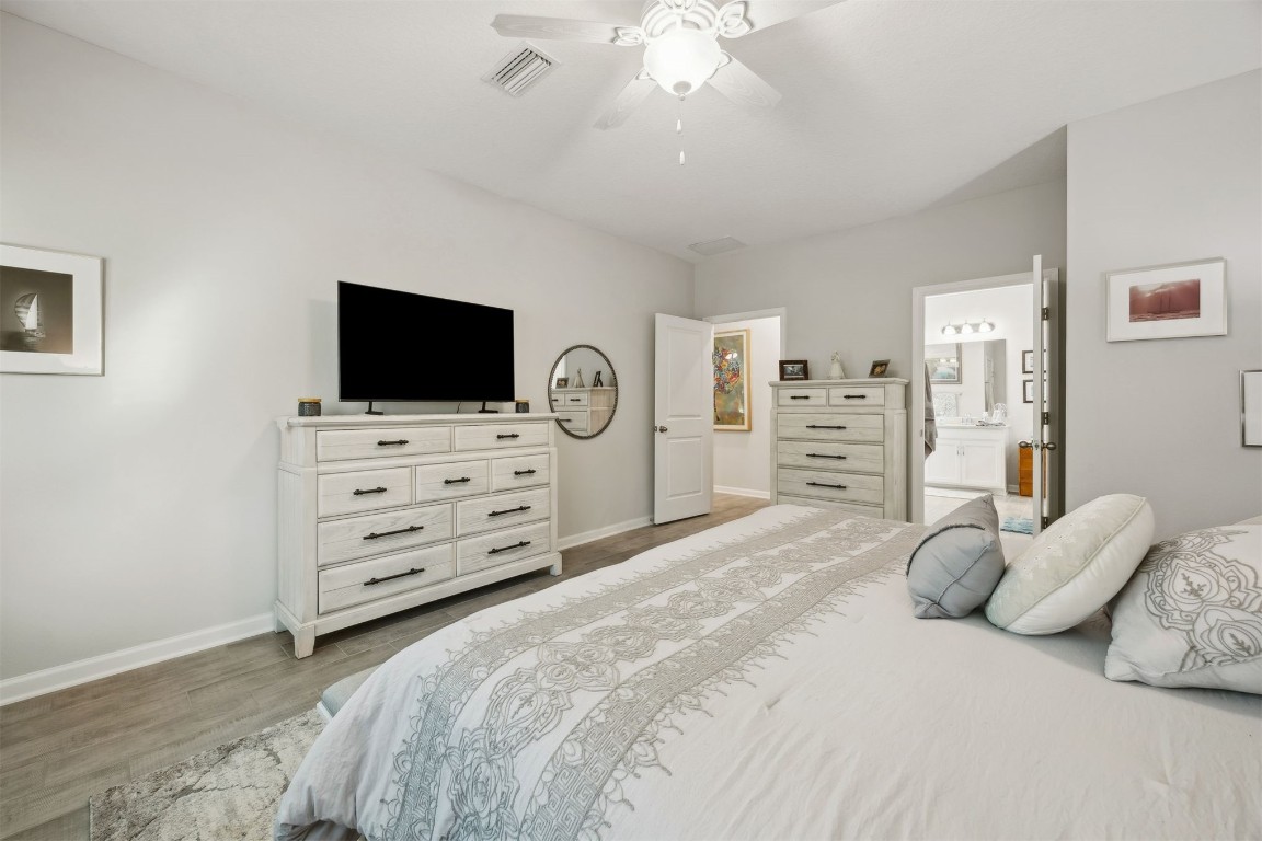 75505 Banyan Way Yulee, FL 32097 - Photo 26 of 94 a bedroom with a bed and flat screen tv