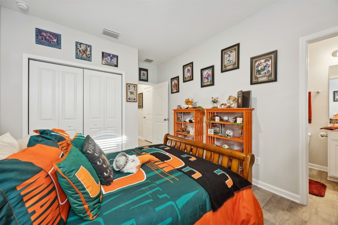 75505 Banyan Way Yulee, FL 32097 - Photo 40 of 94 a bedroom with a bed and painting on the wall