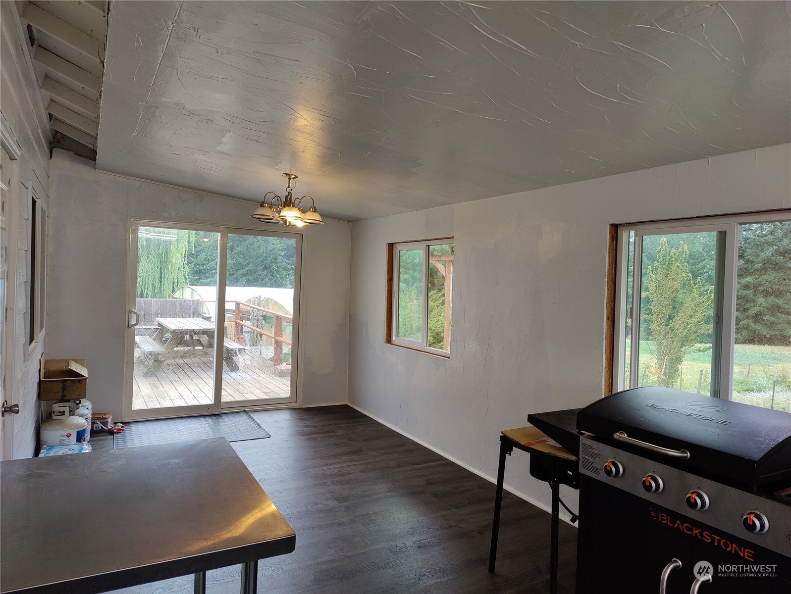 126 Reinseth Road Winlock, WA 98596 - Photo 16 of 33 a room with furniture and large windows