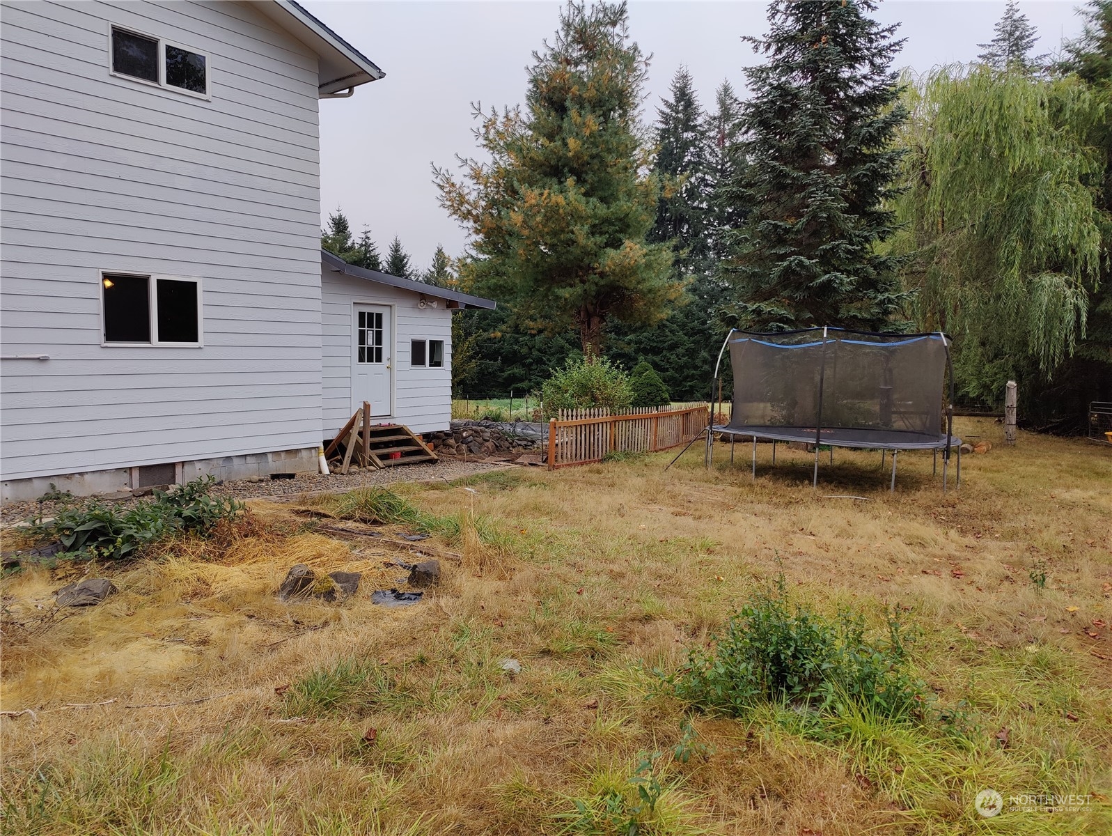 126 Reinseth Road Winlock, WA 98596 - Photo 23 of 33 a backyard of a house with table and chairs