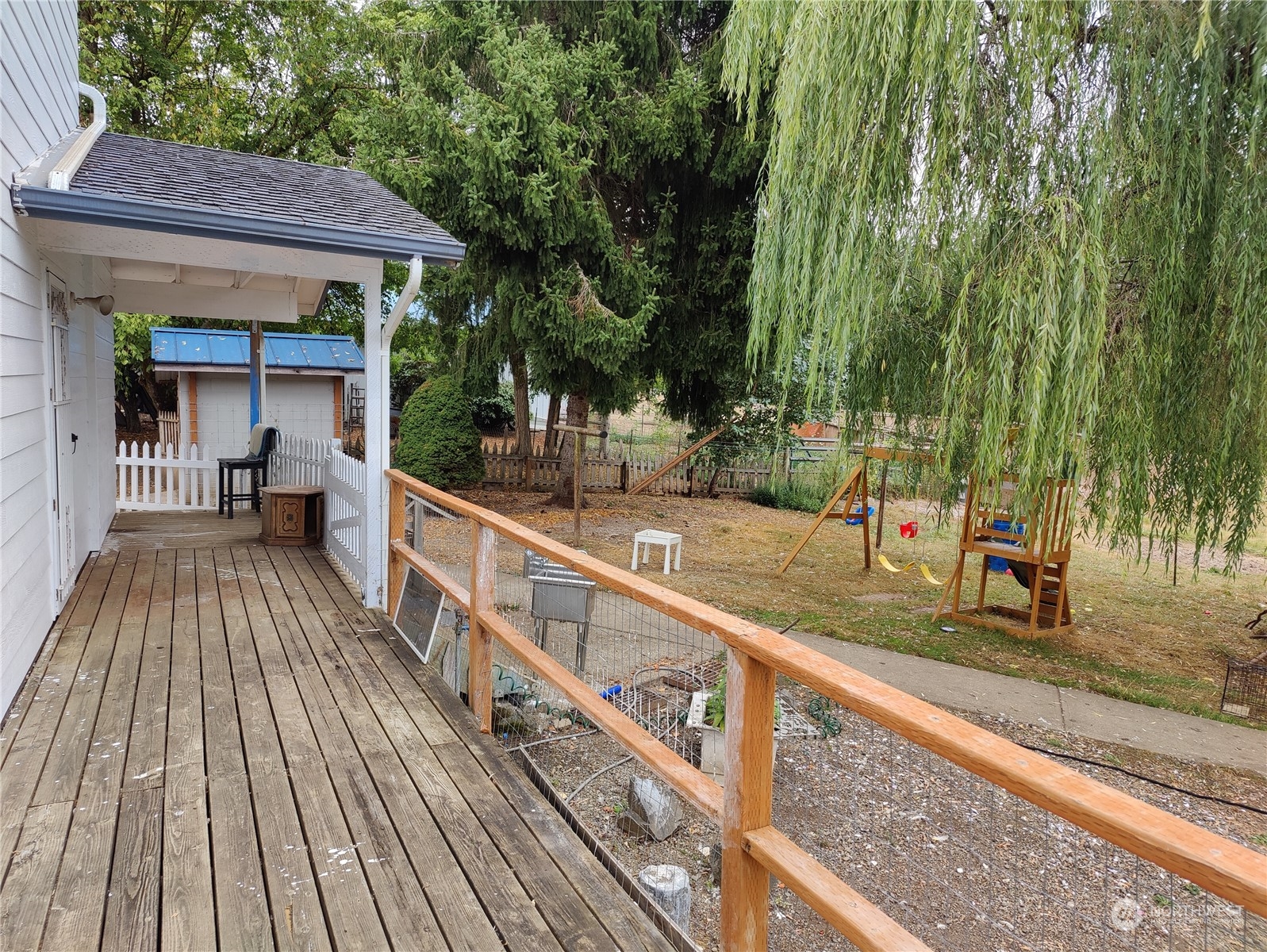 126 Reinseth Road Winlock, WA 98596 - Photo 24 of 33 a view of a wooden deck with a yard