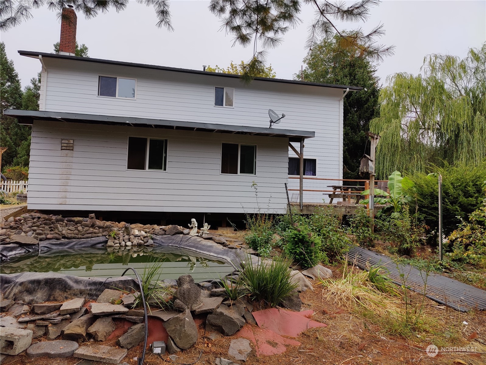 126 Reinseth Road Winlock, WA 98596 - Photo 27 of 33 a front view of a house with garden