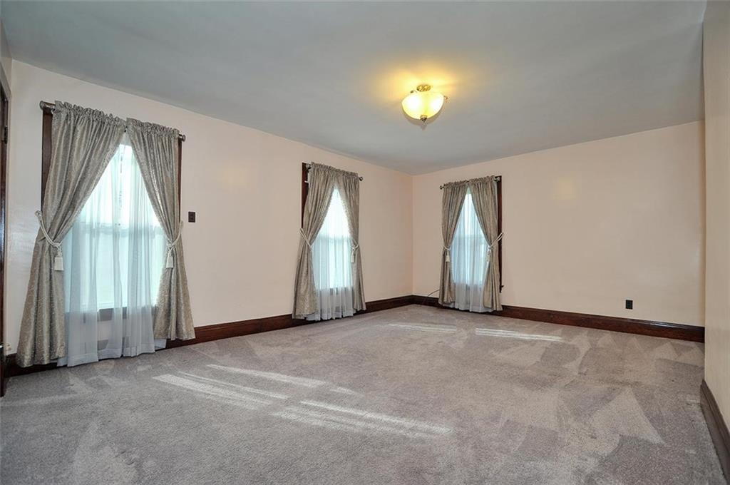 25 Wabash Avenue Hickory, PA 15340 - Photo 13 of 29 an empty room with a window and fireplace